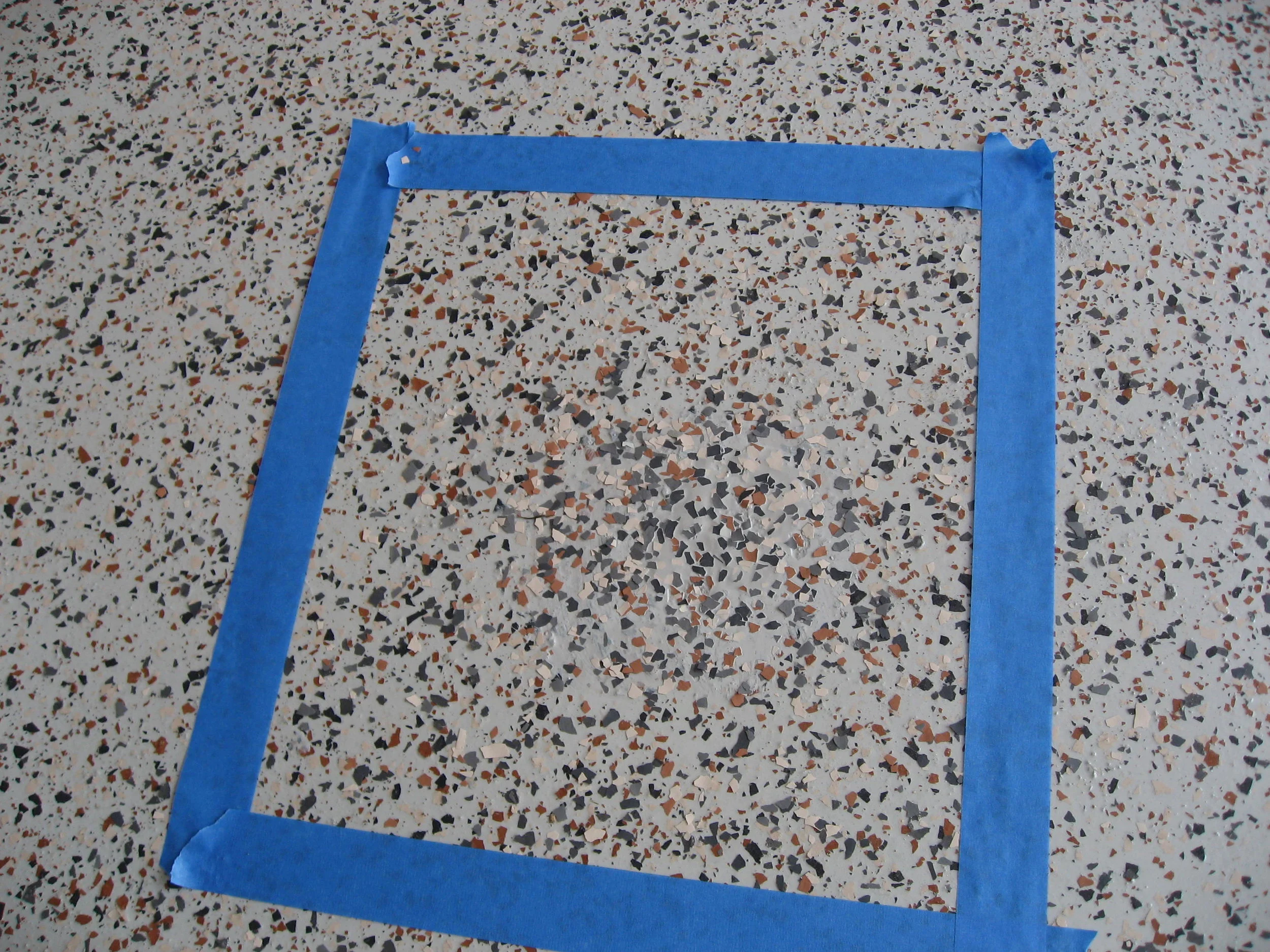  Three coat epoxy color chip system, gray basecoat, 1/4” color chip, custom color chip blend 