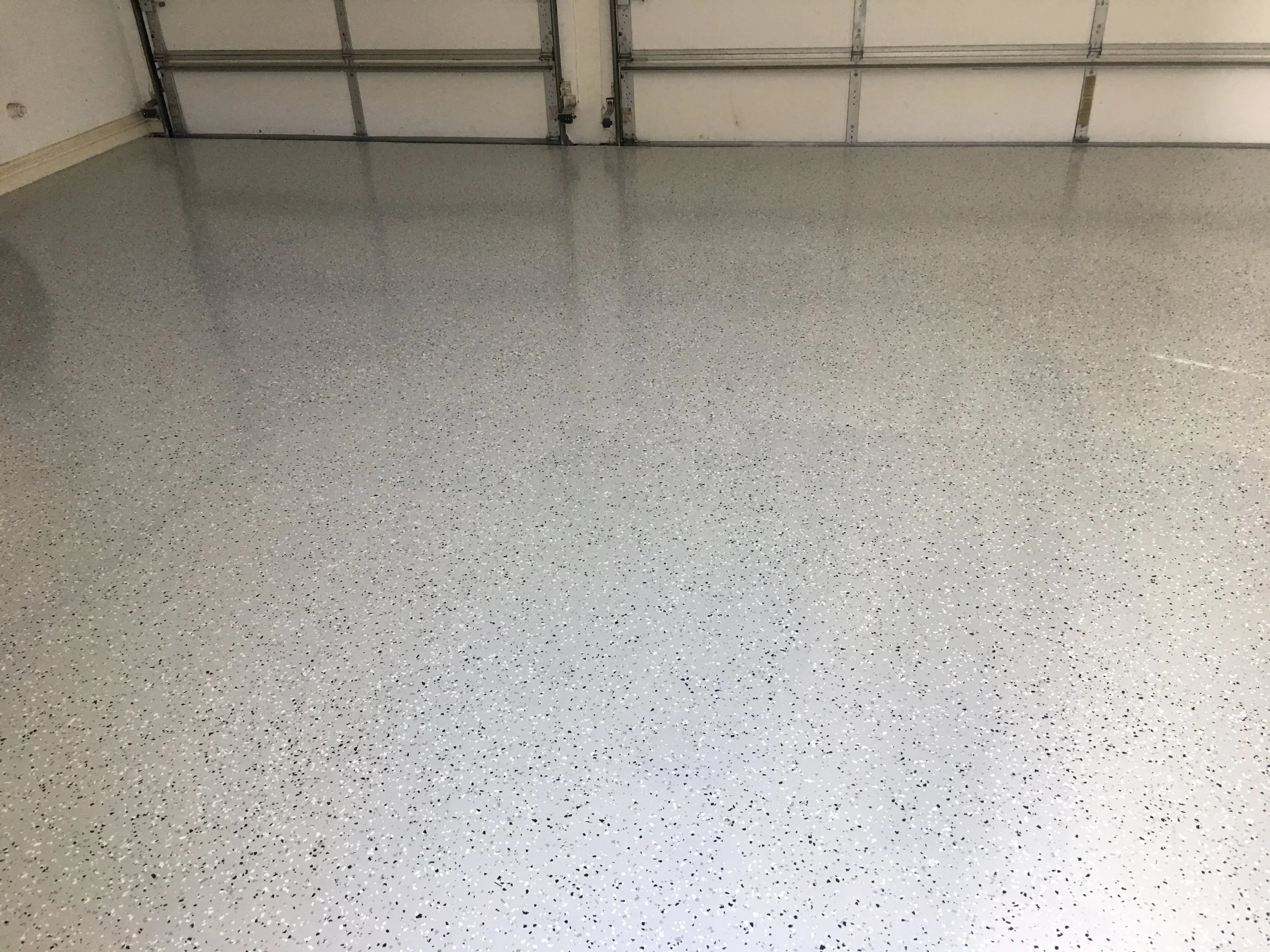  Three coat epoxy color chip system withstands heavy and continuous traffic 