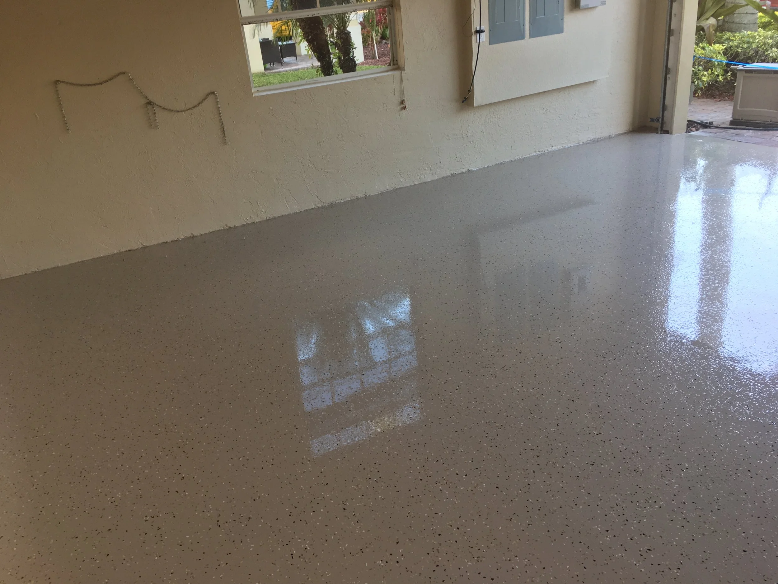  Durable, hard-wearing three coat epoxy color chip system, 1/4” color chips, medium broadcast 