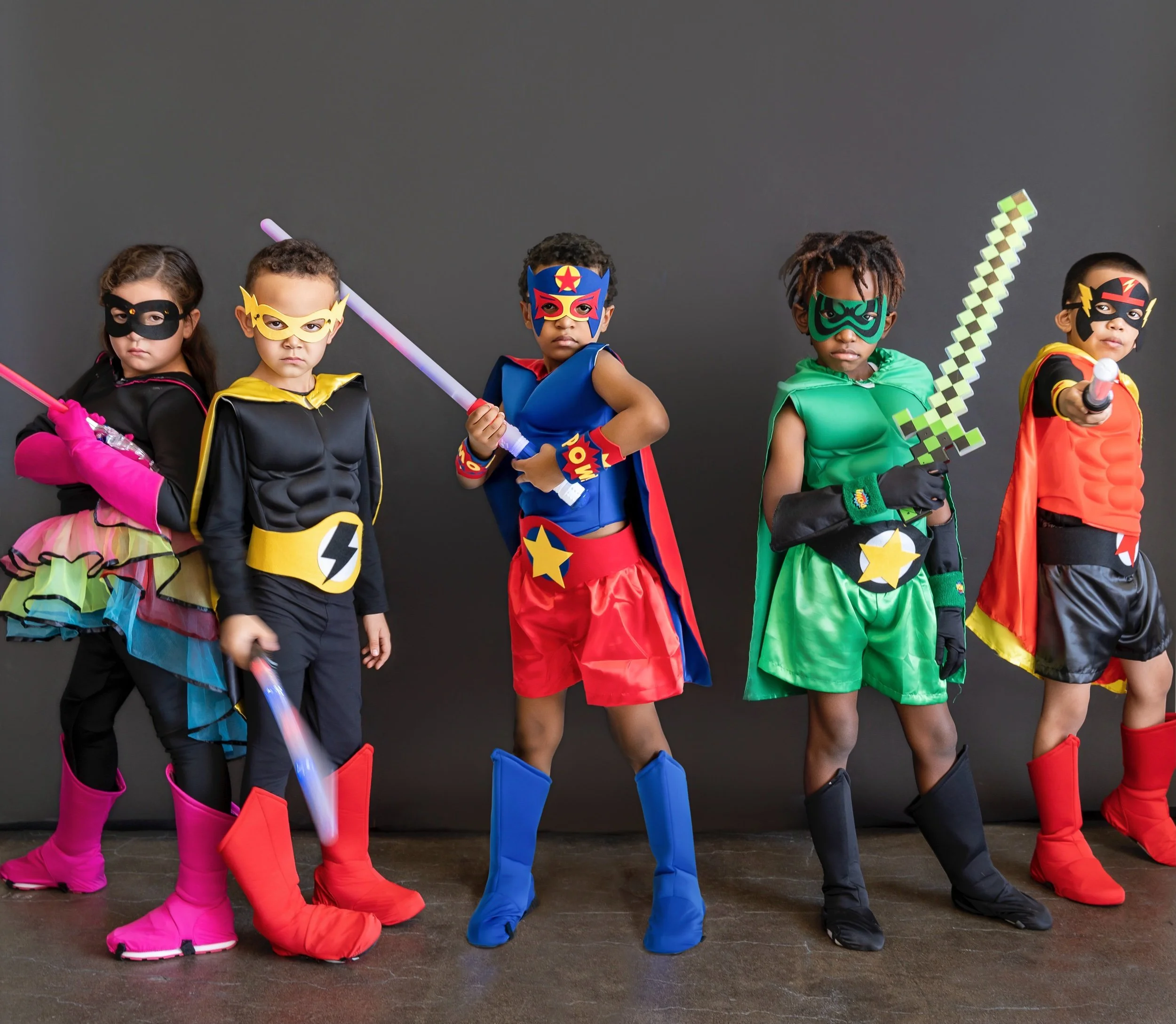 Brand Photography of kids in marvel costumes in a studio 