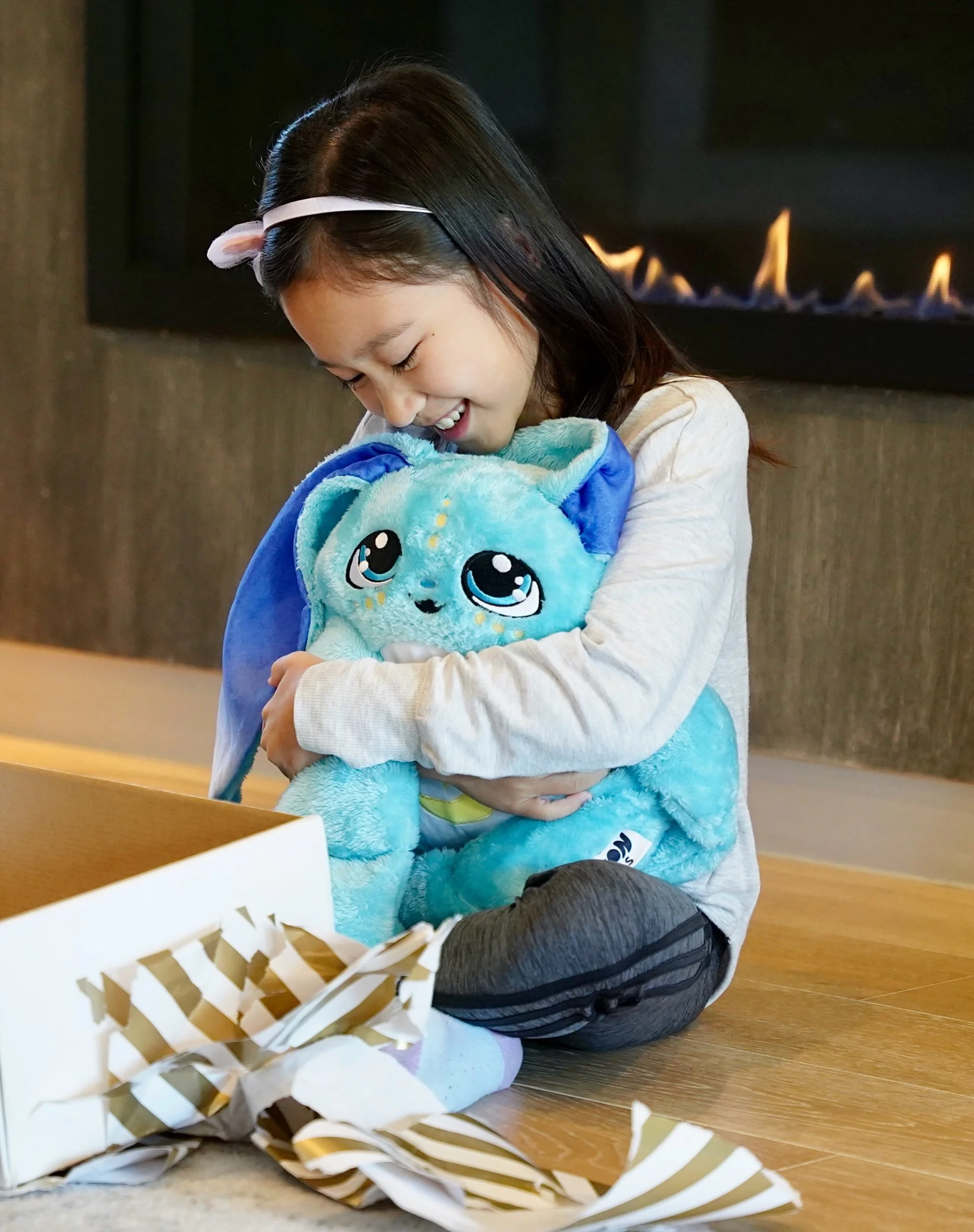 Lifestyle Photography of a little girl holding a squish toy 