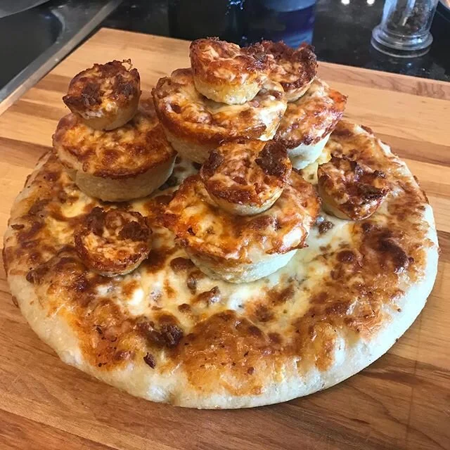 Used my leftover pizza dough in a muffin and mini muffin tin. Pizza Castle!
