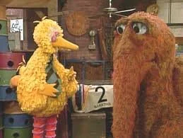 A picture of Big Bird and Snuffleupagus in deep conversation
