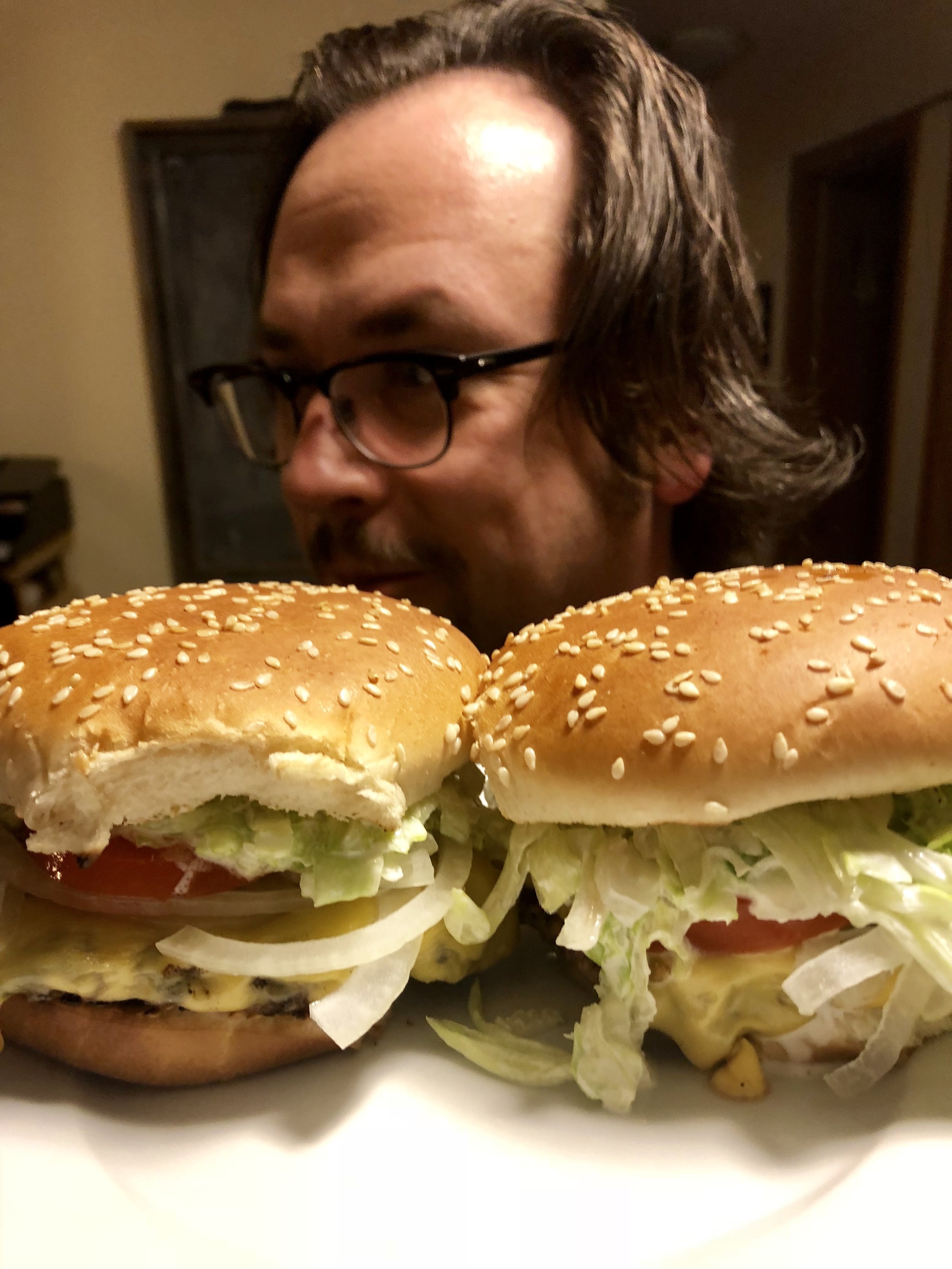 A man and his own home grilled burgers