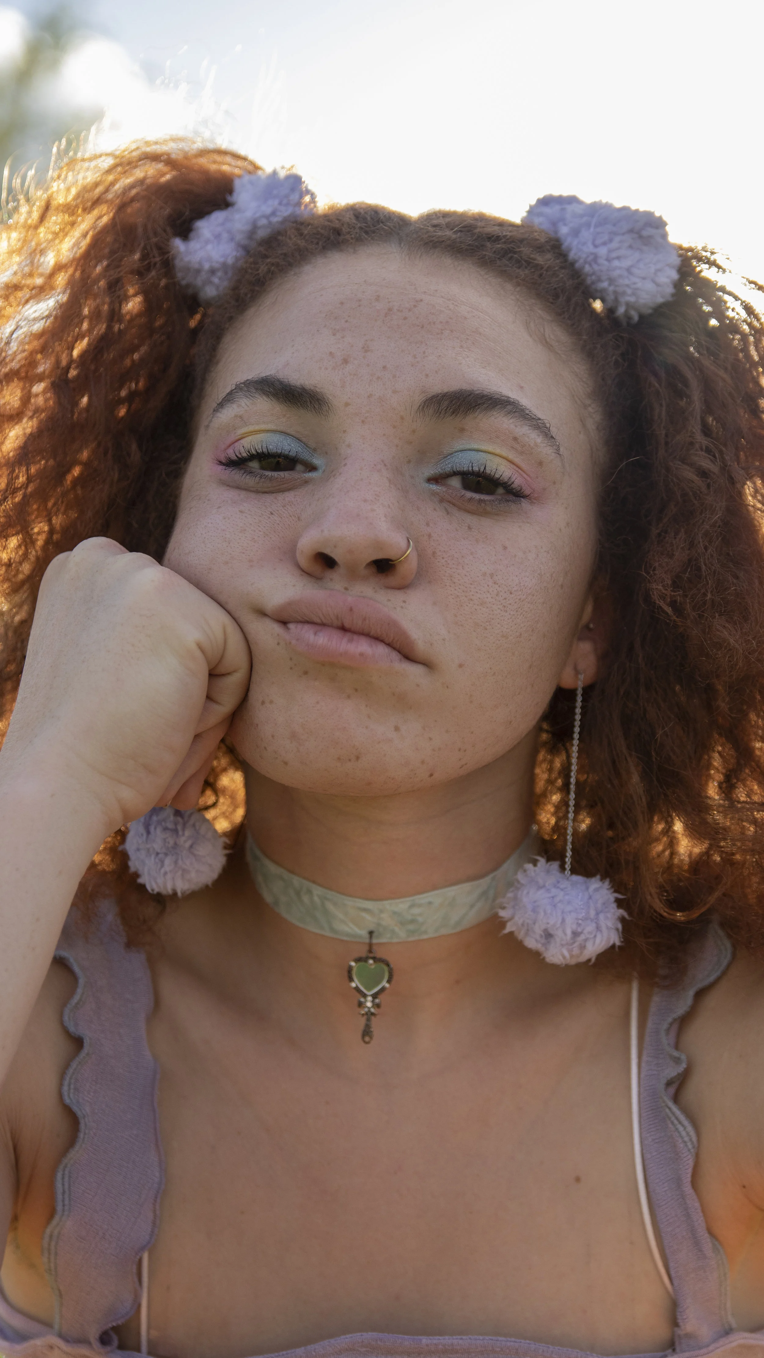 purple dangly puff earrings