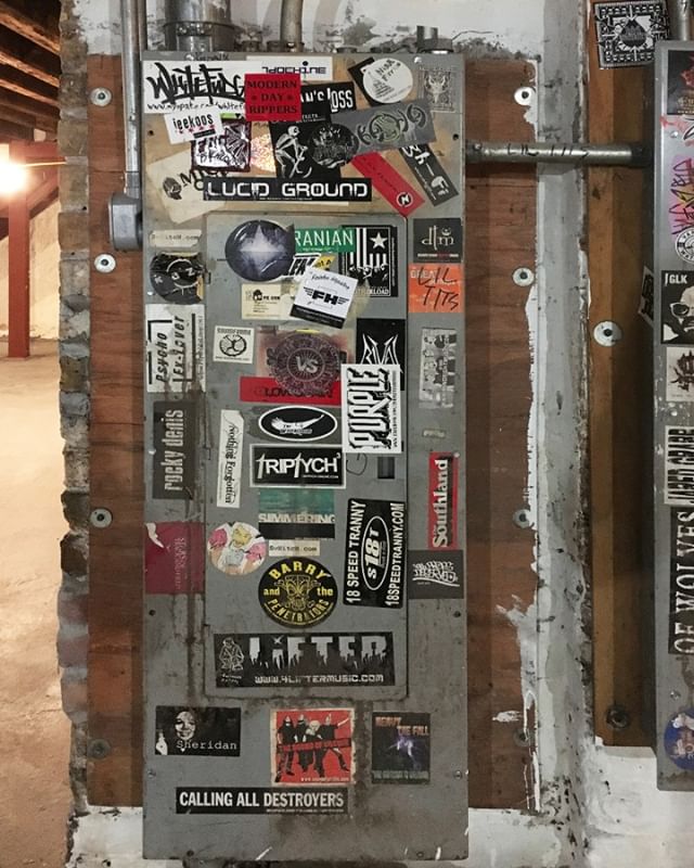 Double Door, Basement electrical panels with band stickers.  Wicker Park, Chicago 2017.