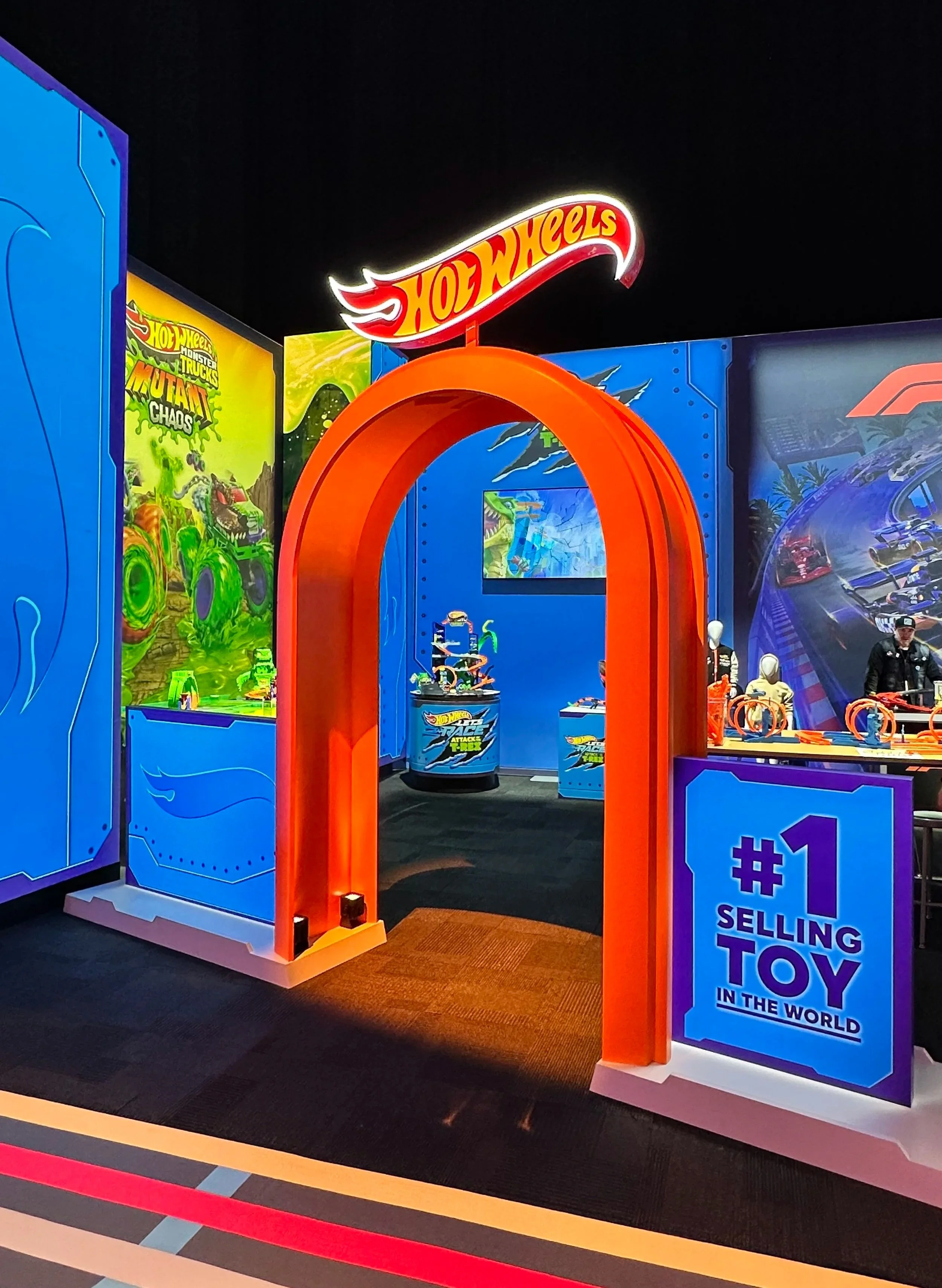 An archway at a toy trade show for Mattel Hot Wheels race cars