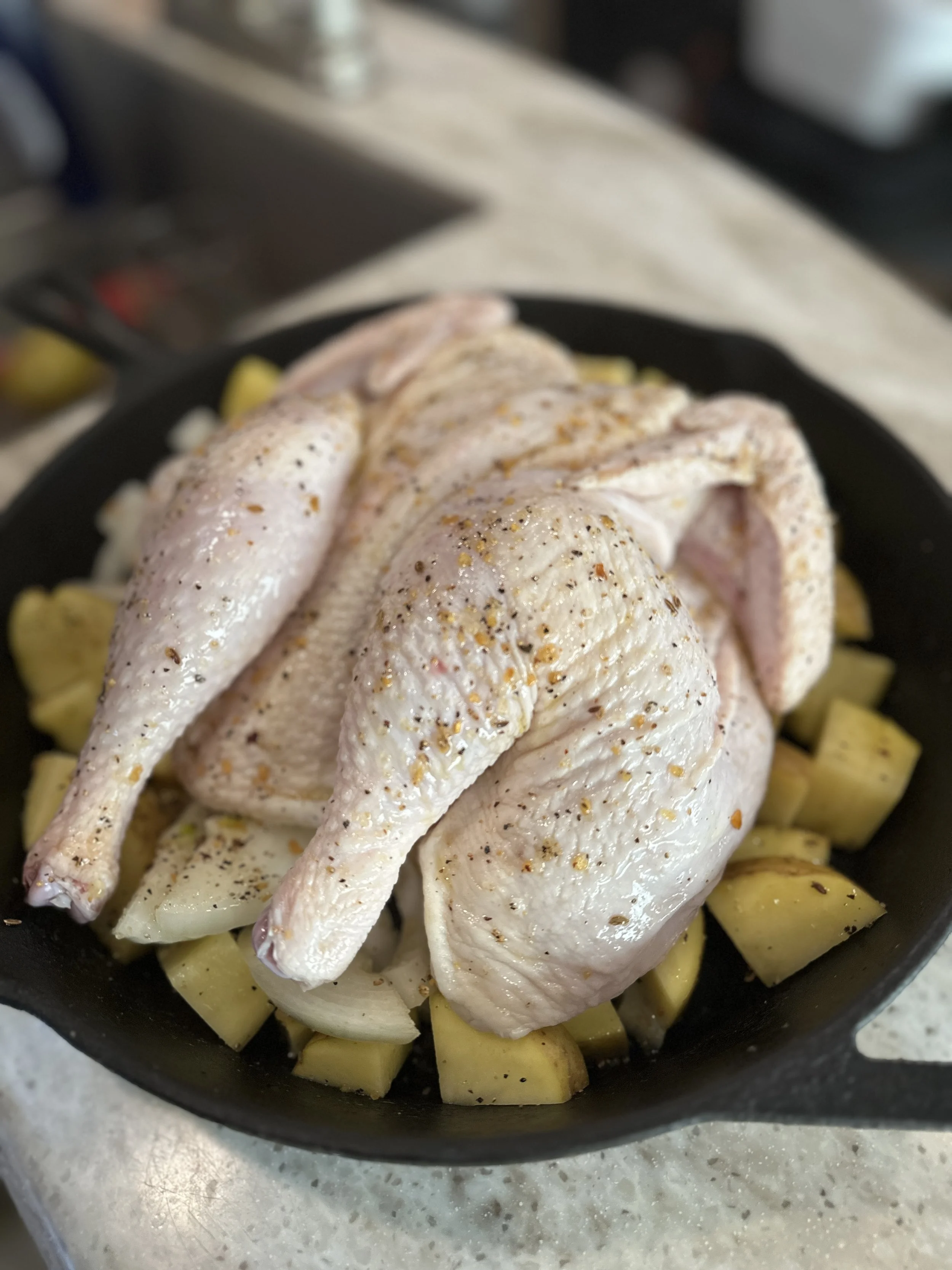 Spatchcock Chicken over Potatoes