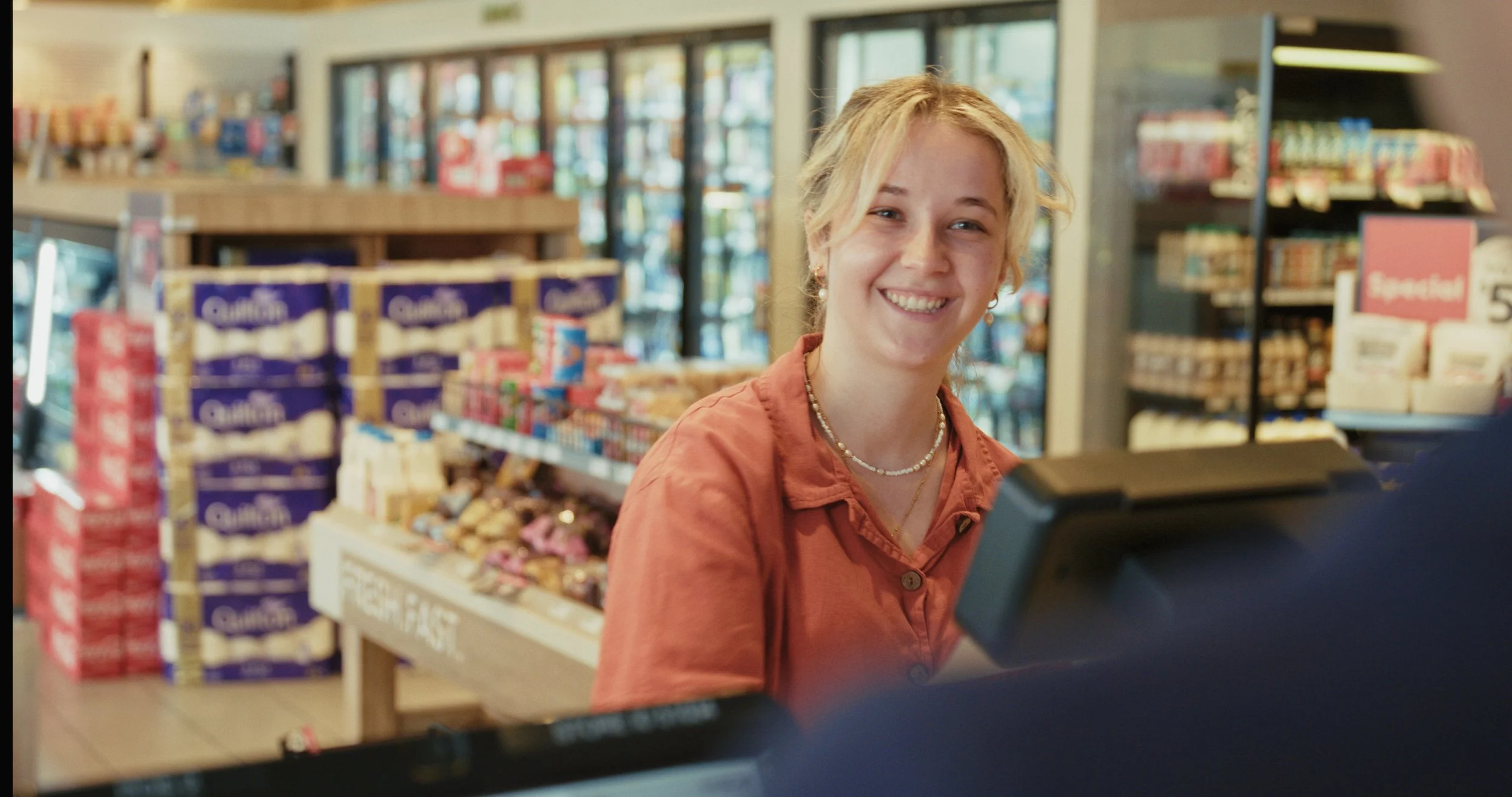 A still from a video we created for Ampol of a woman purchasing something