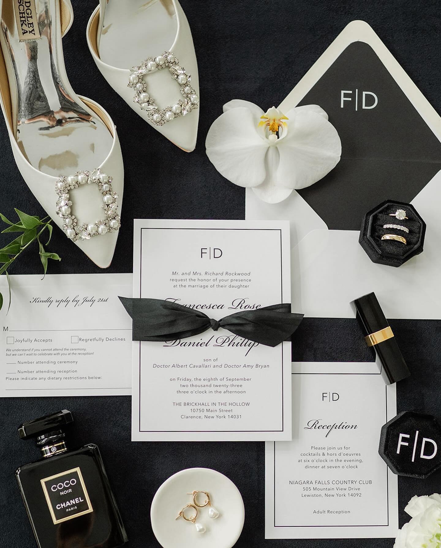 F + D went for a classic and neutral look for their invitation suite. They started with our Tessa semi-custom design and made it their own! They changed fonts and colors, and added a monogram, black silk ribbon, and an envelope liner.

Our semi-custo