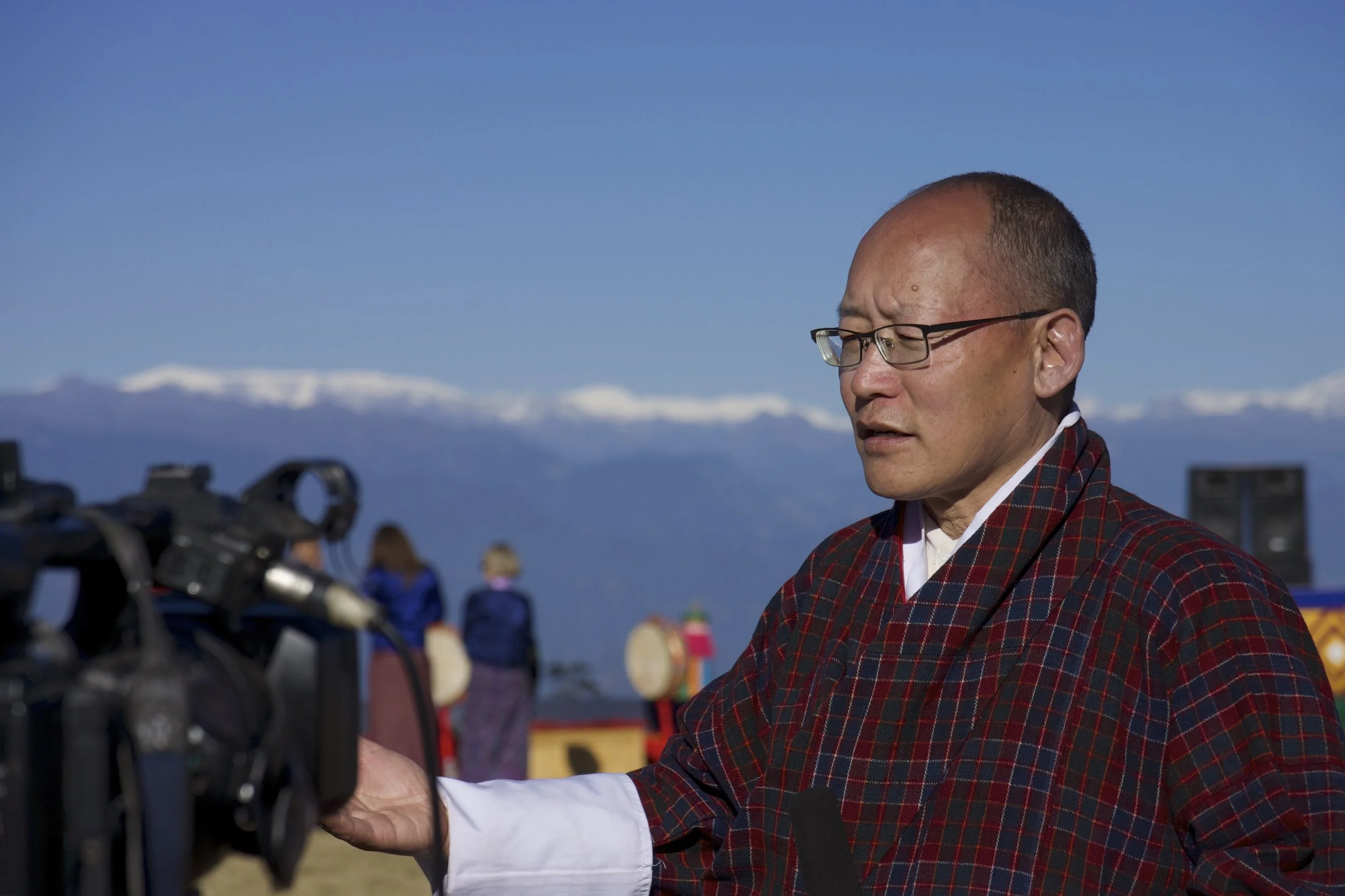 Dr. Karma Ura taking an interview after the Druk Wangyel Tsechu
