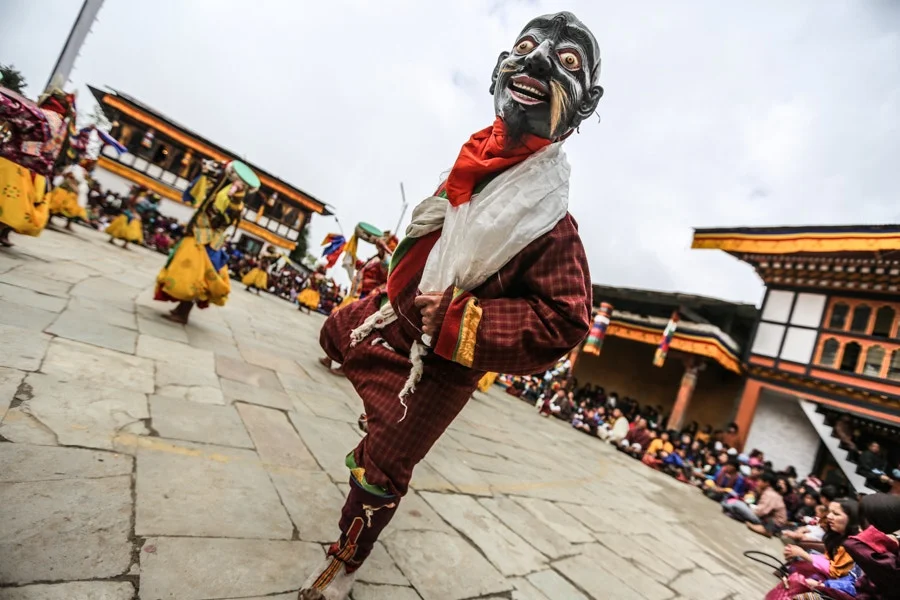 Humorous blessing at Padtsheling Tsechu, Bumthang