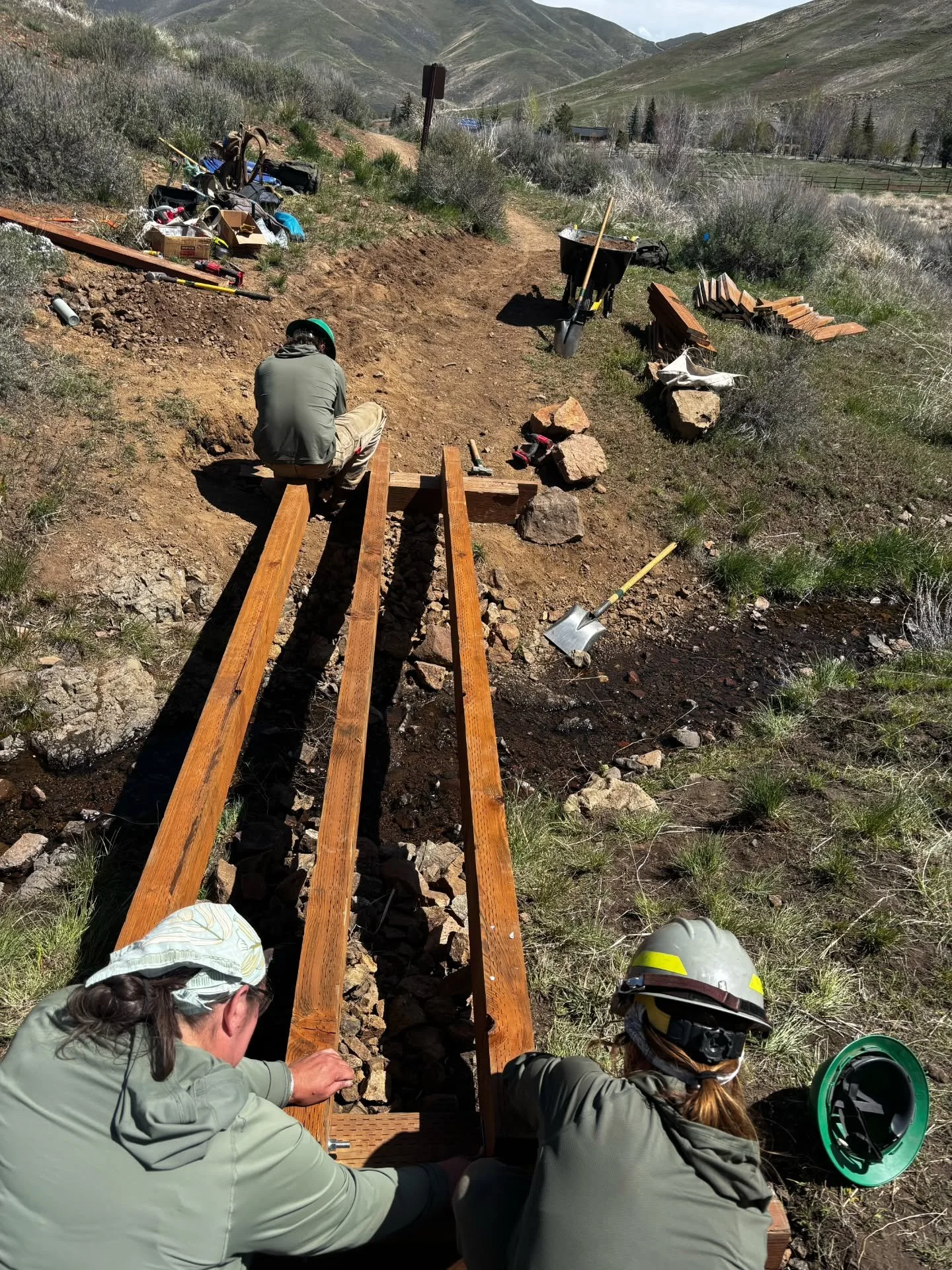 New Nadia's Bridge Friday! 🪻🌼🌻

If you've been riding, running, or sauntering on the Nadia's Trail this spring, you've felt the unmistakable give of the old bridge.  The old lumber that gave the bridge its structural support was bendin' and breaki