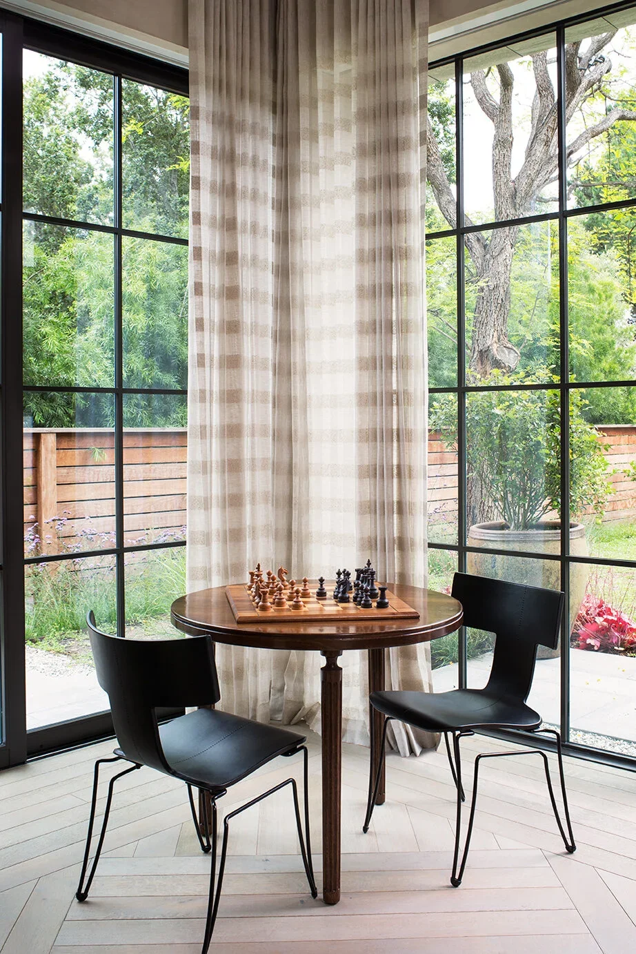 Library-Chess-Table-Steel-Windows-Patterned-Wood-Floors-Perfitt-Richards-Interior-Design.webp