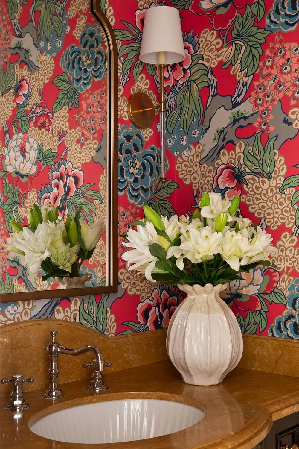 17-powder-room-sink-with-vibrant-red-wallpaper-perfitt-richards-interior-design.webp