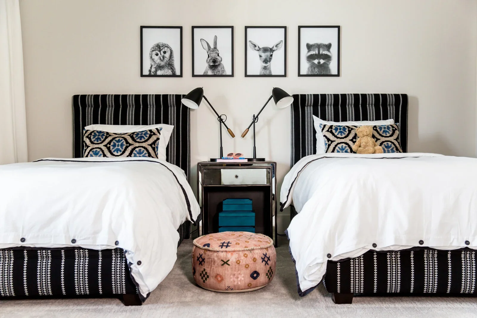 Modern-Girls-Bedroom-Vacation-Home-Animal-Mug-Shots-Black-White-Beds-Perfitt-Richards-Interior-Design.webp