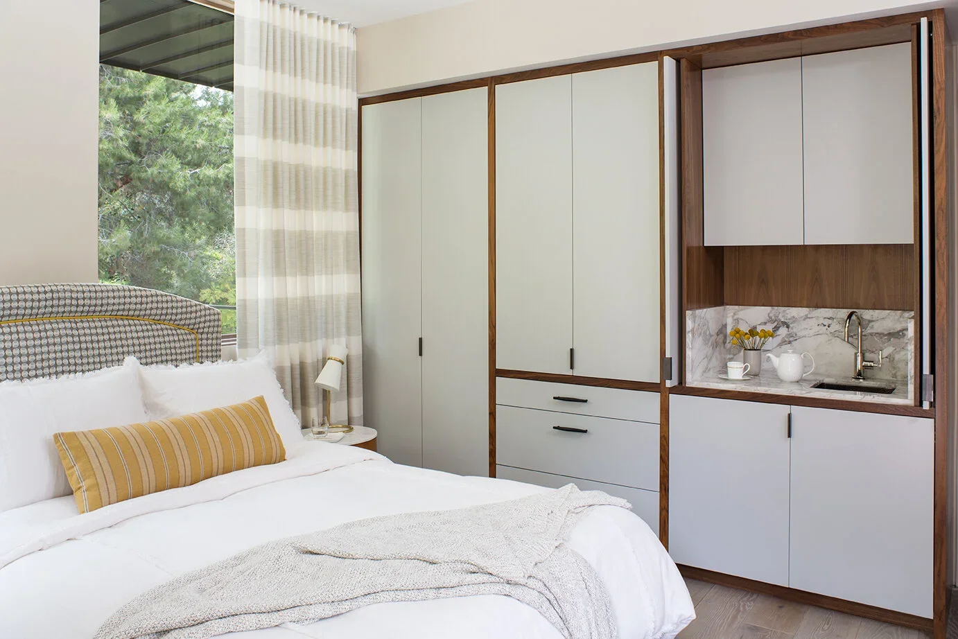 Guest-Bedroom-Built-in-Cabinets-Bar-Sink-Perfitt-Richards-Interior-Design.webp