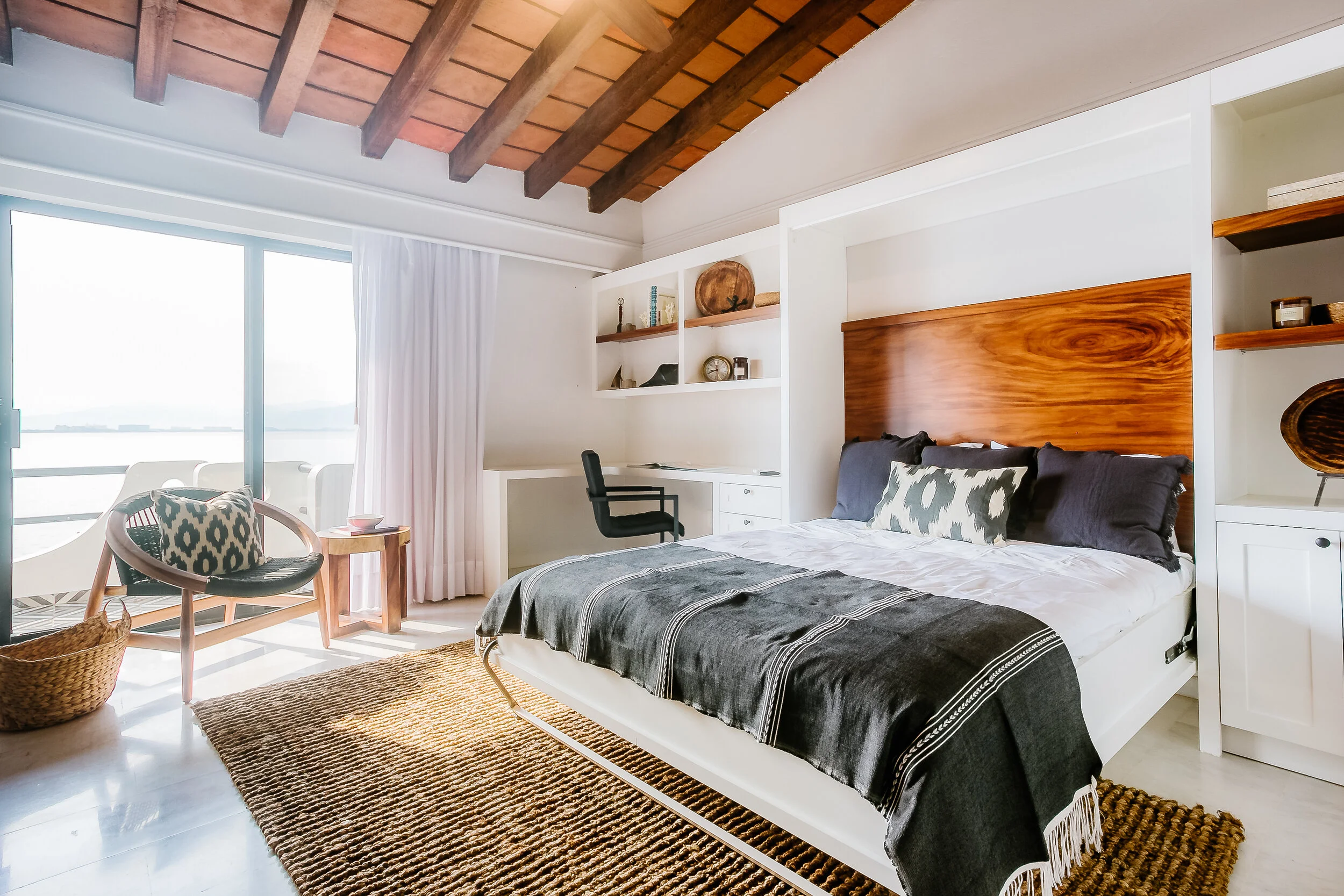 The home office which doubles as a guest room with a custom wall-bed solution.