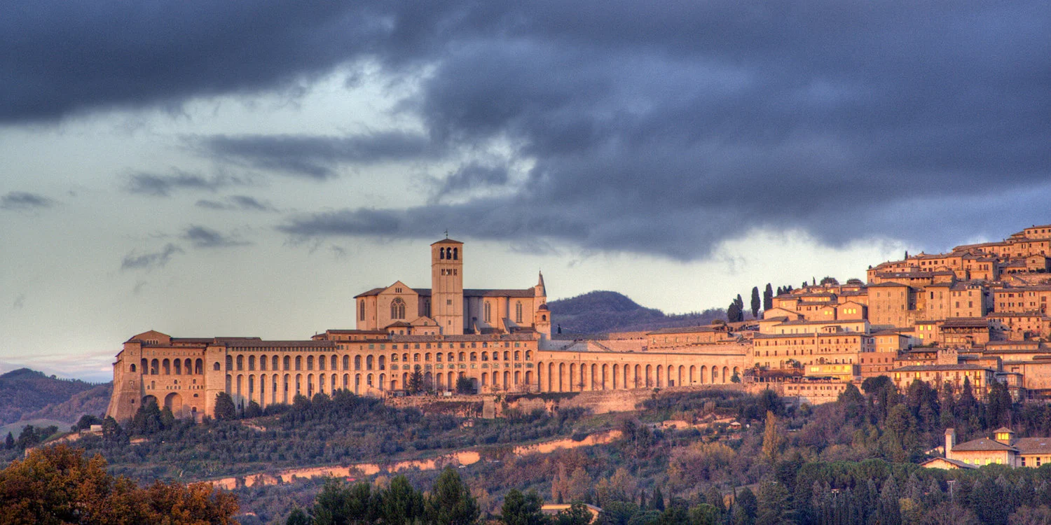 Assisi at sunset: this is one of the world’s great pilgrim destinations and the birthplace of Santa Chiara and San Francisco.