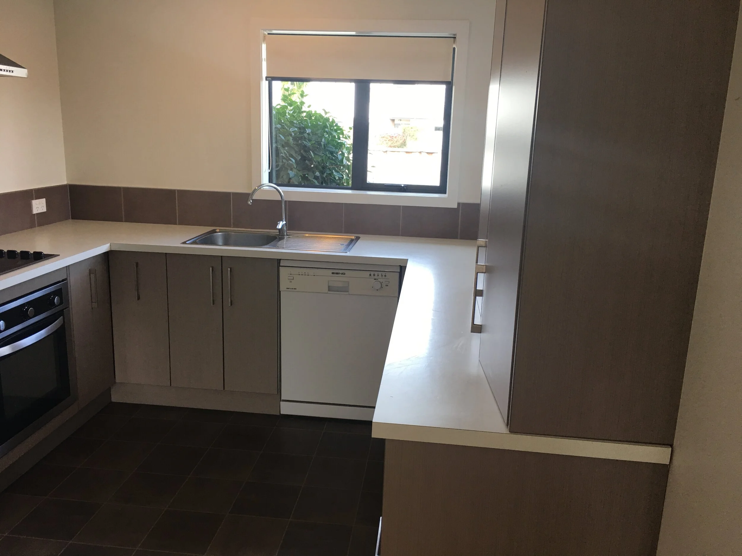 modern kitchen with dishwasher and rangehood