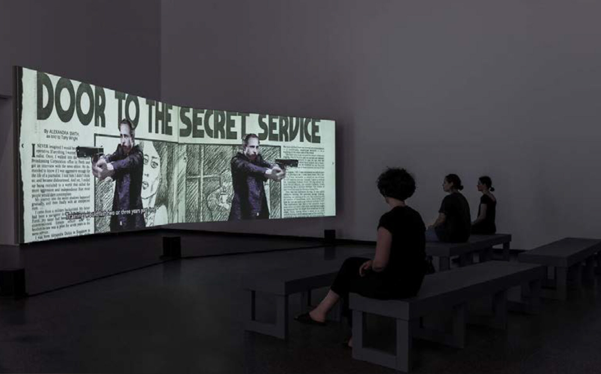  Daniel Jenatsch (Bachelor of Arts (Fine Art) (Honours) 2015),  The Sheraton Hotel Incident , 2018 Two channel HD video, 5.1 surround sound, 15:00 mins installation view,  The Theatre is Lying , ACCA 2018 