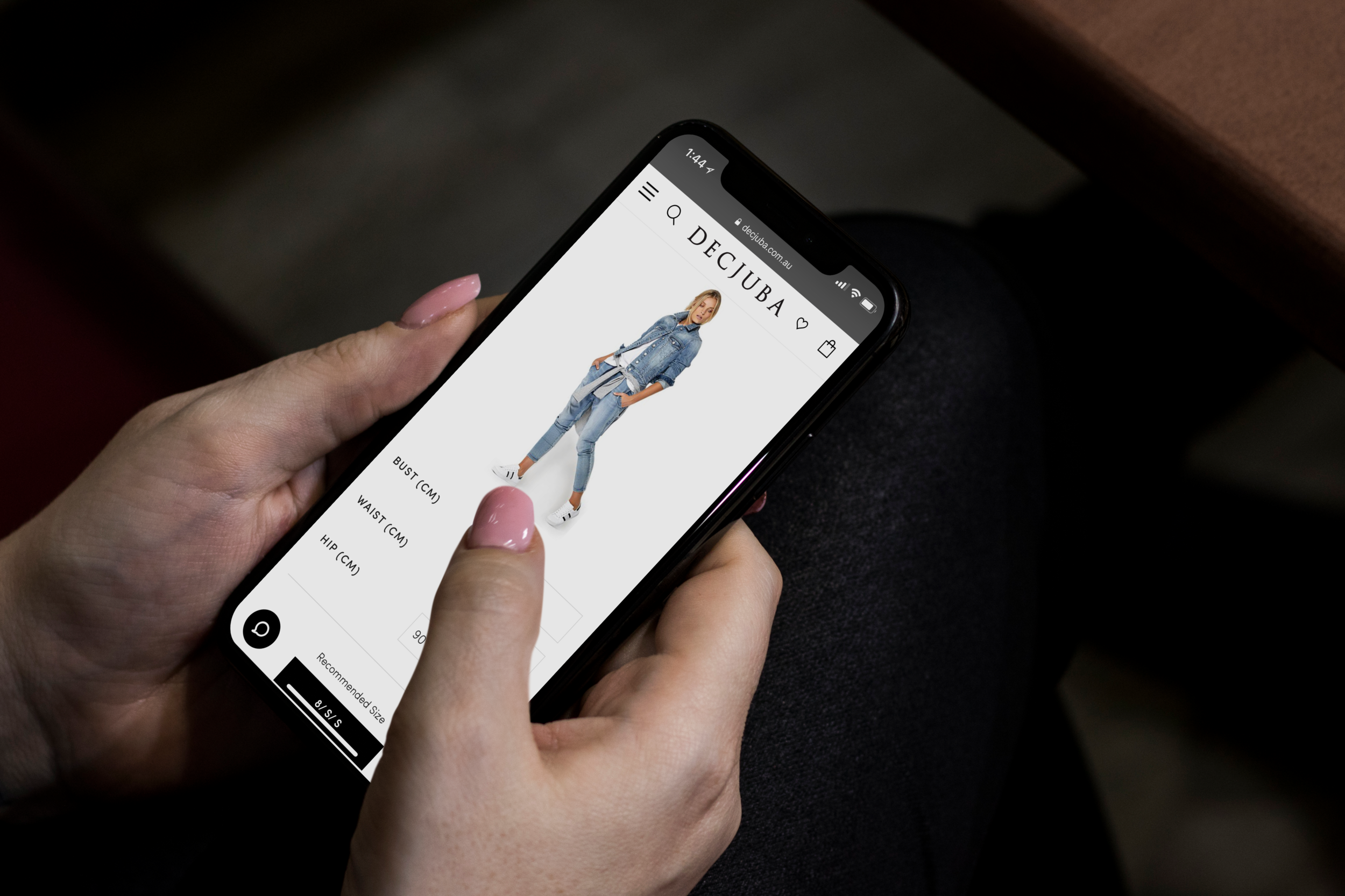 Woman_using_black_iPhone_X_mockup.png