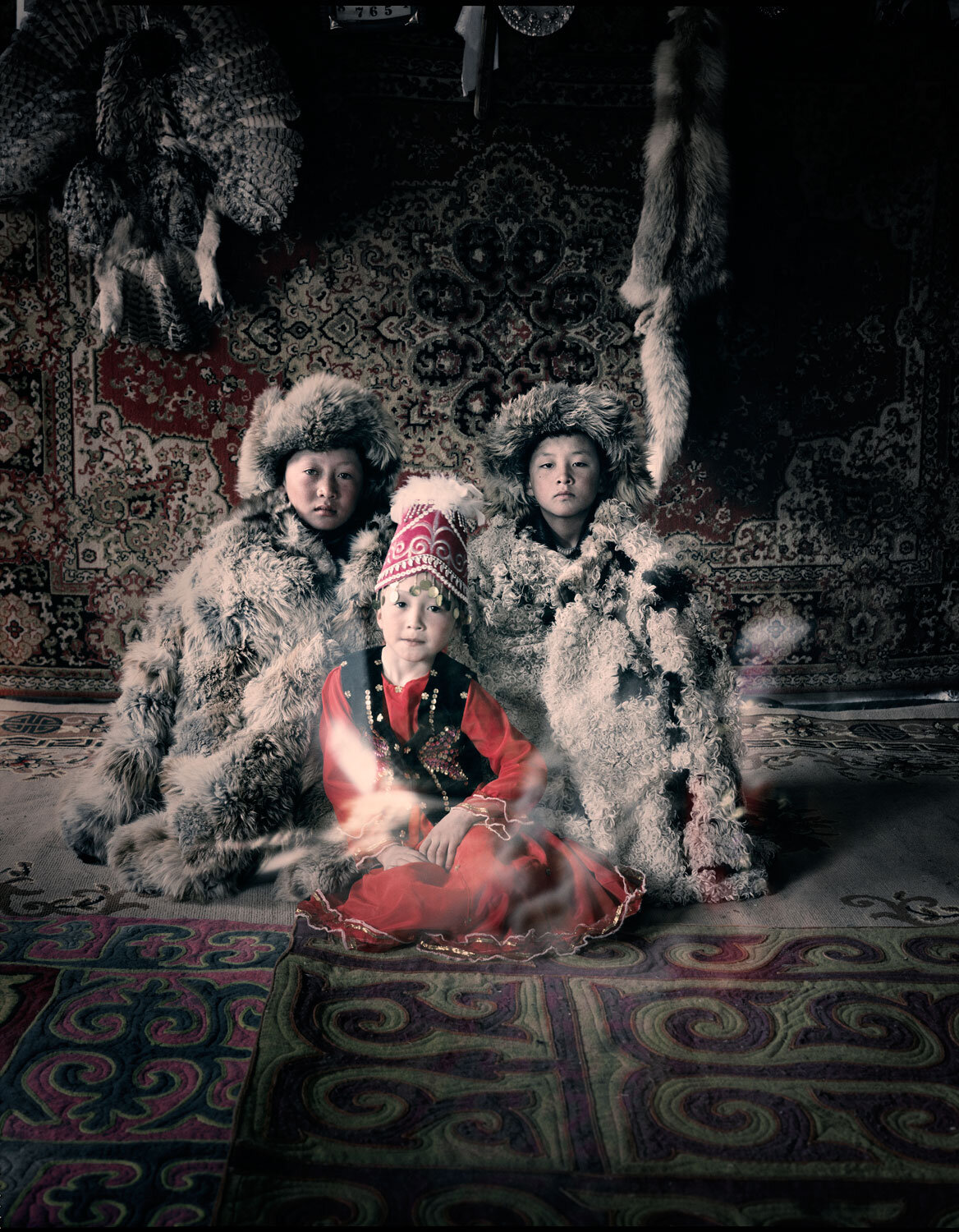 Bakbergen, Samil & Kamilla Altantsogts, Bayan Olgii Mongolia, Jimmy Nelson, 2011.jpg