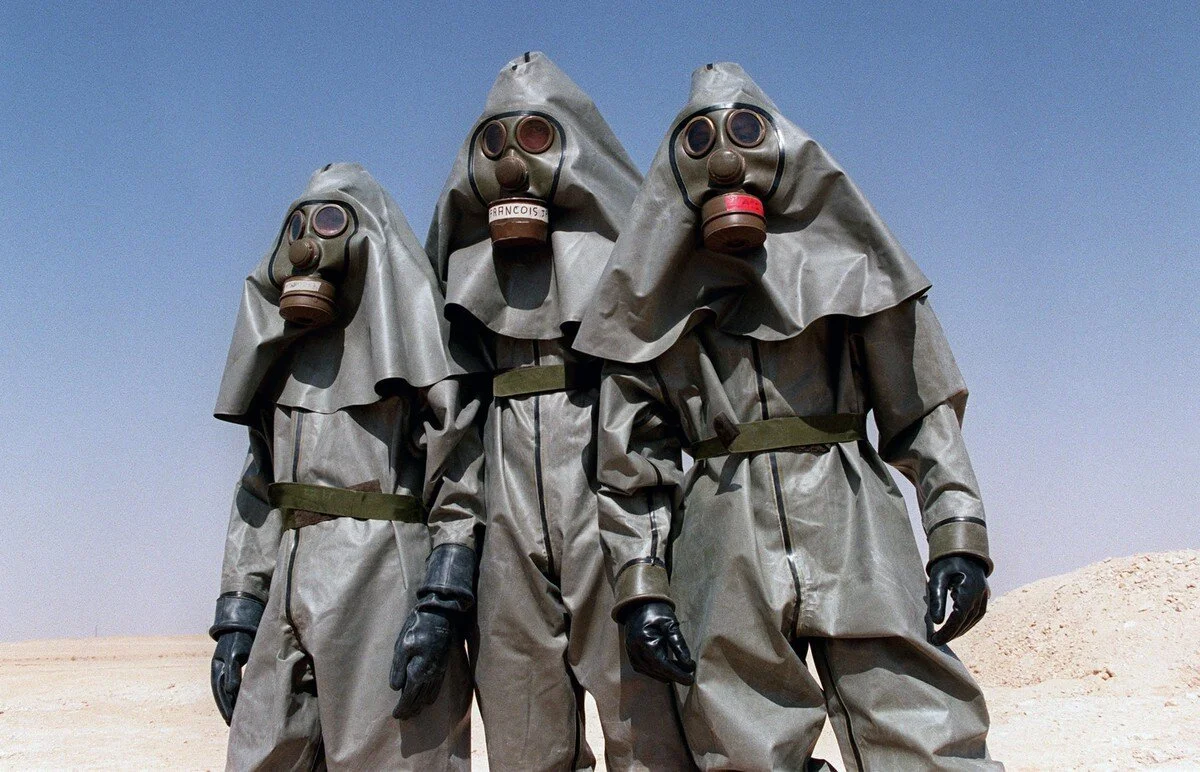 French soldiers from the Foreign Legion Infantry regiment in the Saudi desert near Hafr al-Batin, wear full chemical warfare equipment during a training session during the Gulf War on October 26, 1990. Pascal Guyot / AFP / Getty