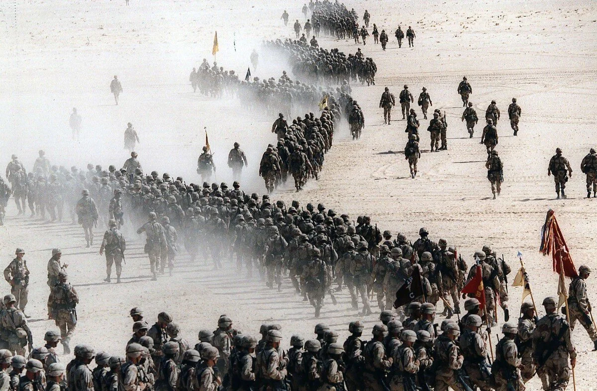 Responding to Iraq's invasion of Kuwait, troops of the U.S. 1st Cavalry Division deploy across the Saudi desert on November 4, 1990, during preparations prior to the Gulf War. Greg English / AP