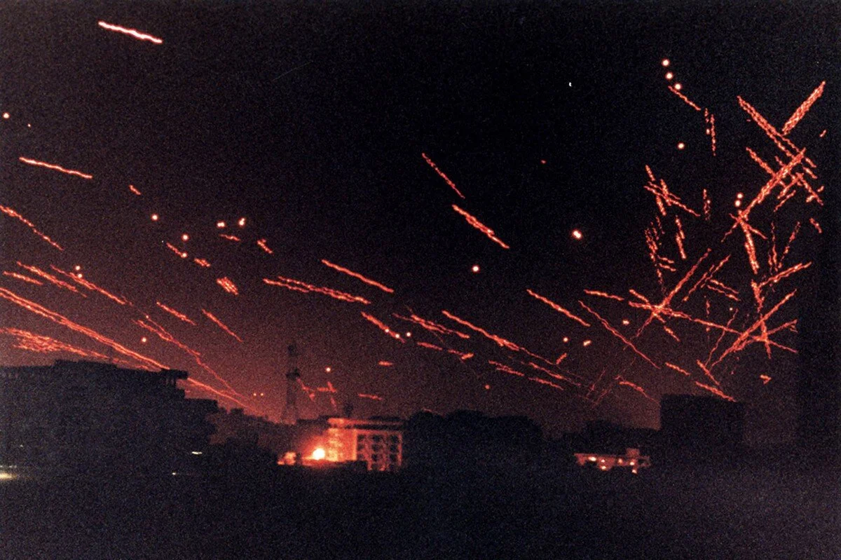 Anti-aircraft tracer lights up downtown Baghdad, in a January 17, 1991 photograph as U.S. Air Force bombers and cruise missiles attack Baghad during the Gulf War. Twenty-five years ago warplanes from the U.S.-led alliance screeched over Kuwait early…