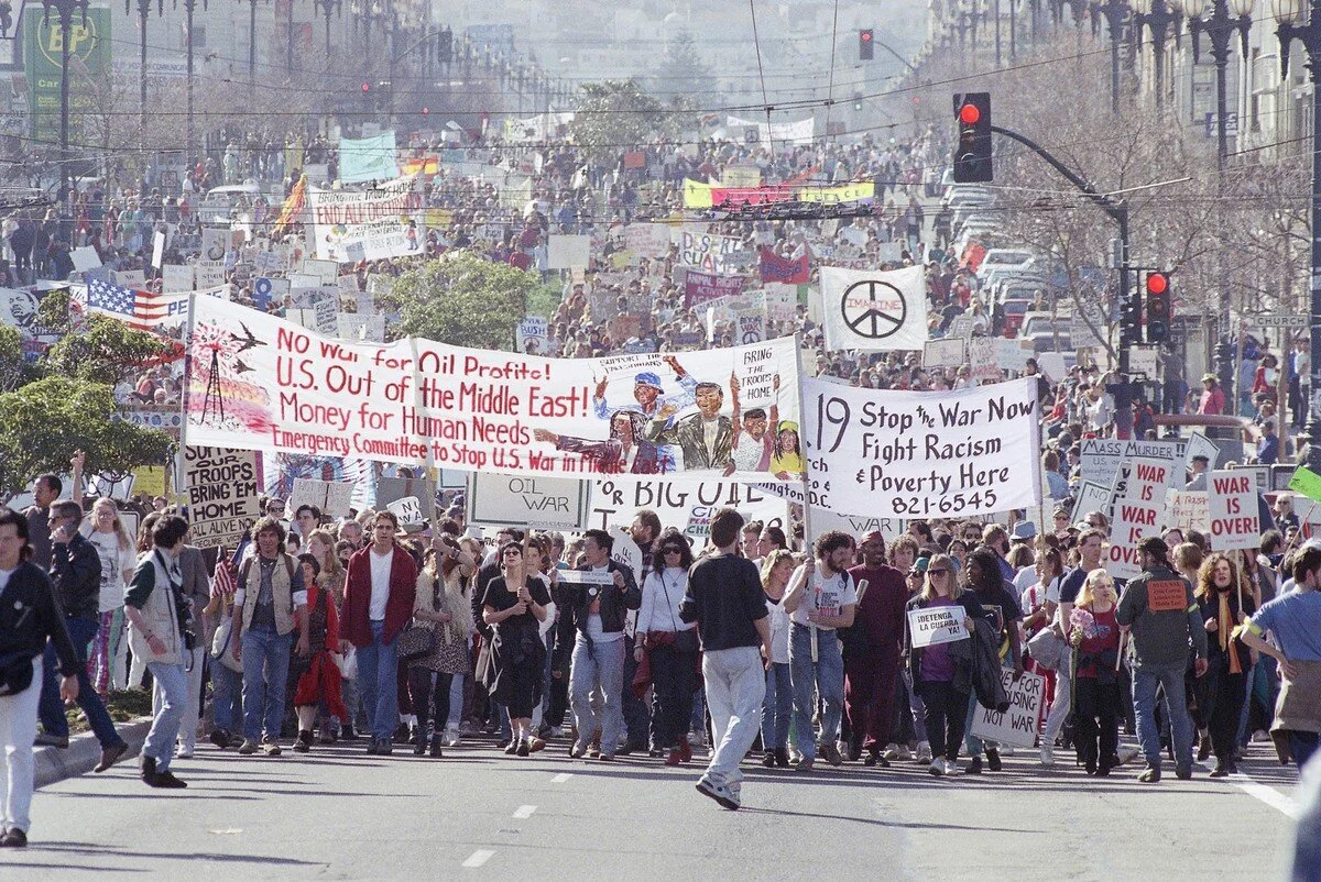 A crowd estimated in the tens of thousands makes its way down Market Street in San Francisco, on January 19, 1991, while protesting the United States attack on Iraq and Kuwait. Eric Risberg / AP
