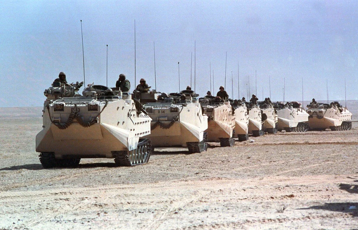 A column of U.S. Marine Amphibious Tracked Vehicles moves north across the desert in Saudi Arabia during the Gulf War on February 17, 1991. Sadayuki Mikami / AP