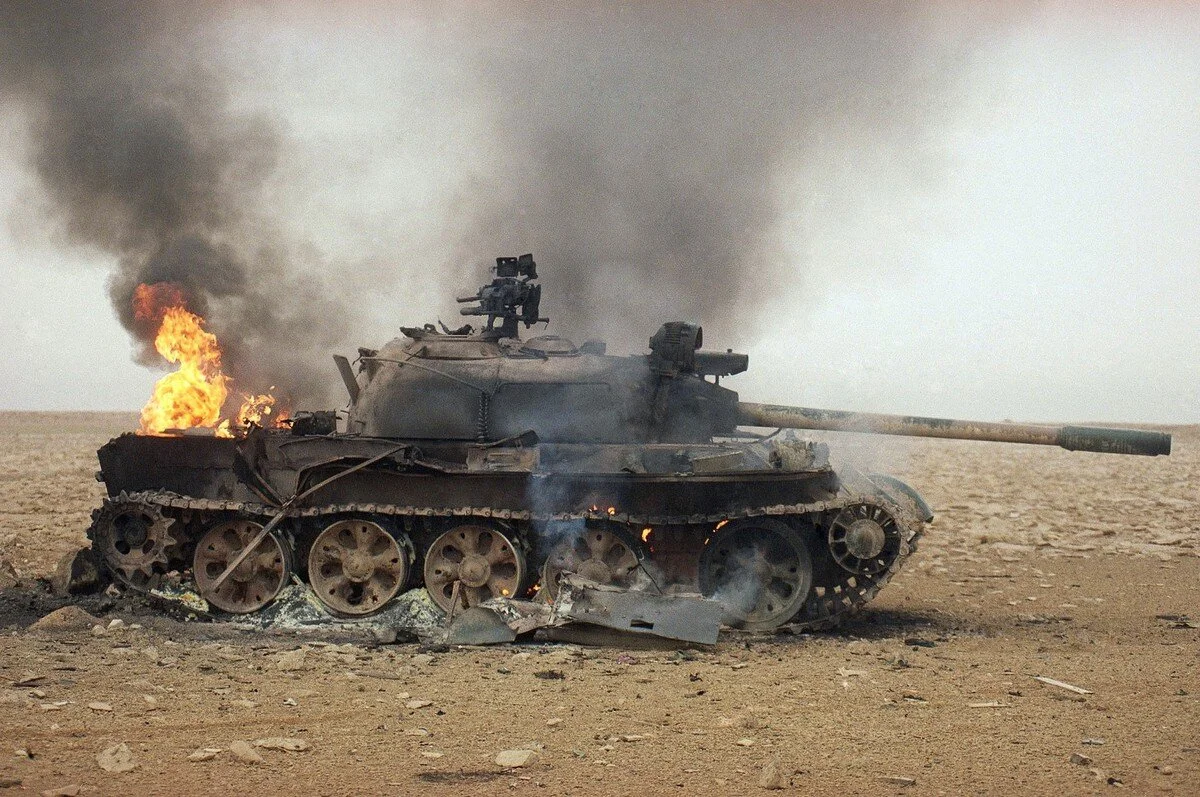 An Iraqi tank goes up in flames after being hit by a TOW missile fired form the U.S. Army’s 82nd Airborne Division, in Iraq on February 27, 1991. Tannen Maury / AP