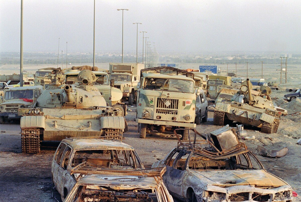 A long line of vehicles, including destroyed Iraqi Army Russian-made T-62 tanks and trucks stand abandoned by fleeing Iraqi troops on the outskirts of Kuwait City, on March 1, 1991, after the Allied troops liberated the capital of Kuwait. Pascal Guy…