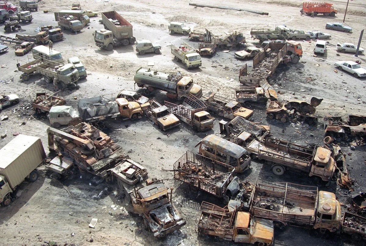 A devastated convoy of vehicles on a highway north of Kuwait City is visible in this aerial photo made on March 1, 1991, during the Gulf War. Iraqi forces fleeing the city in every available vehicle were intercepted by allied forces and destroyed. S…