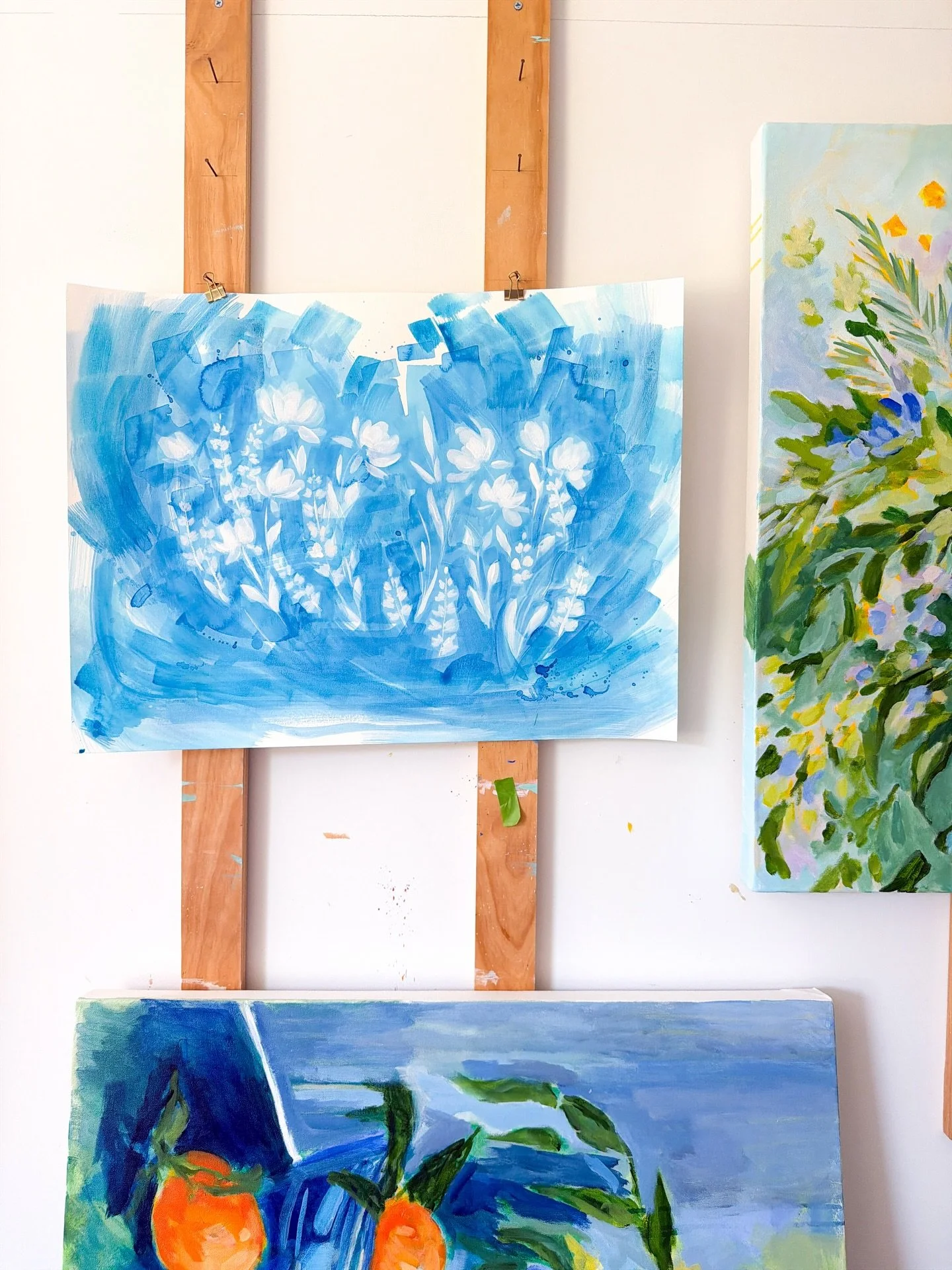 Wednesday Studio Scenes! Lots of different things happening lately. Large florals, a crazy still life featuring a bowl of oranges, a vase of peonies and a plate of sardines. Obviously. One day I will paint these hanging boards white so they aren&rsqu