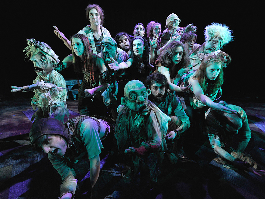 A Greek chorus of puppet and human townspeople was constantly reshaping itself and changing puppeteers.