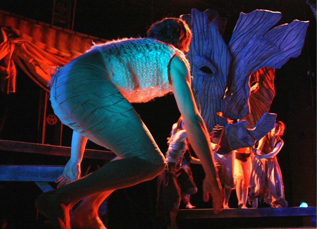 Icarus battles with Poseidon in a dream. The Poseidon puppet was a massive mask made of five parts controlled by separate puppeteers, allowing it to break into pieces and transform itself.