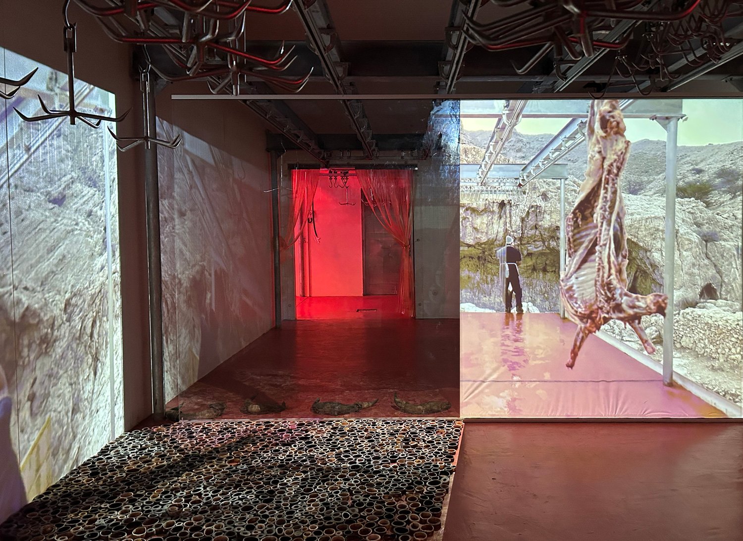   Am 9.0: Sharjah Slaughterhouse Tour:  Cave allegory room within the slaughterhouse cold rooms using reverse projection film and glass to adjust perceptions and dimensions; and where sliced horns framed the real and imagined thresholds.  See more he