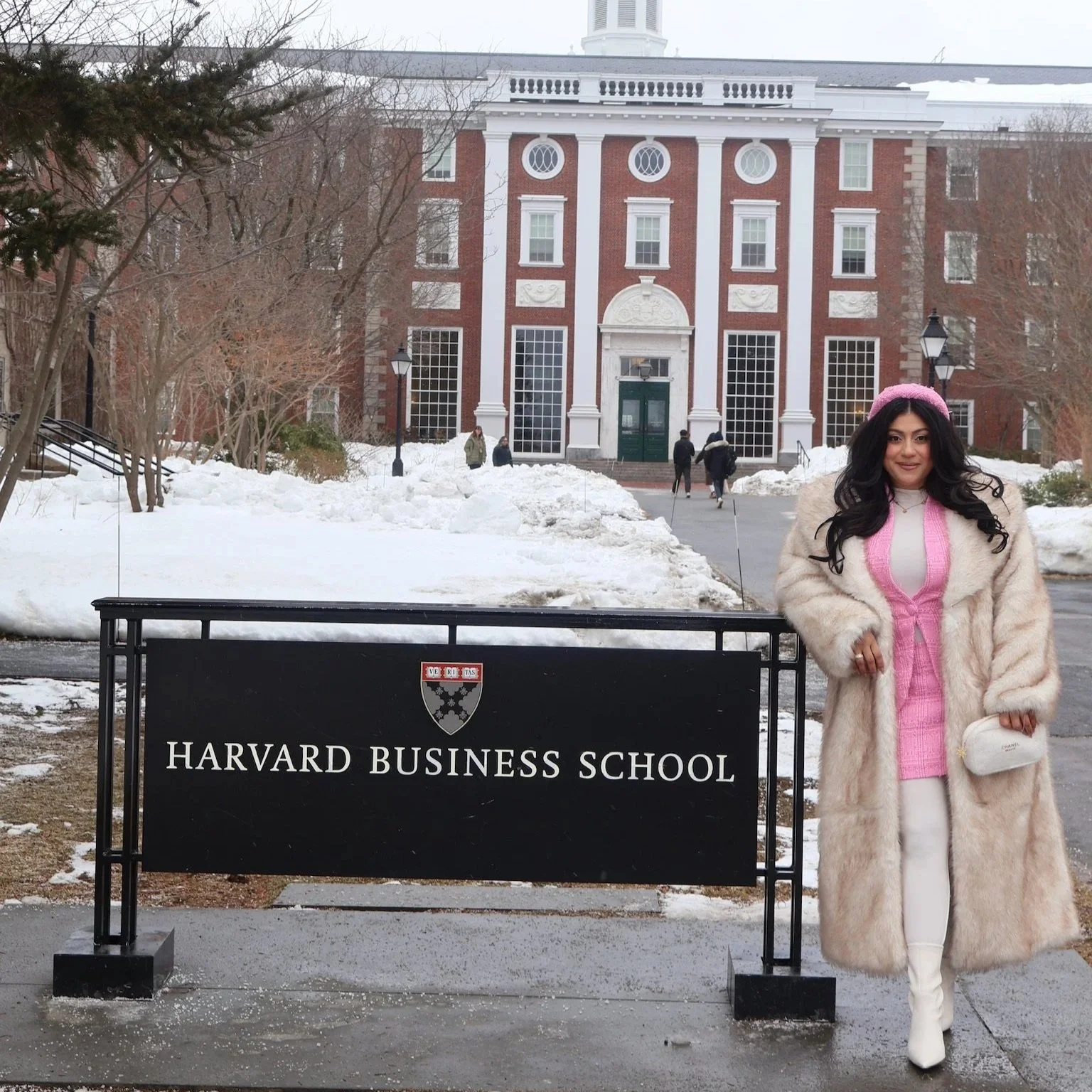 Daniela Madrid Hadges posing with the Harvard Business School sign during the Harvard LEAD Conference in Boston