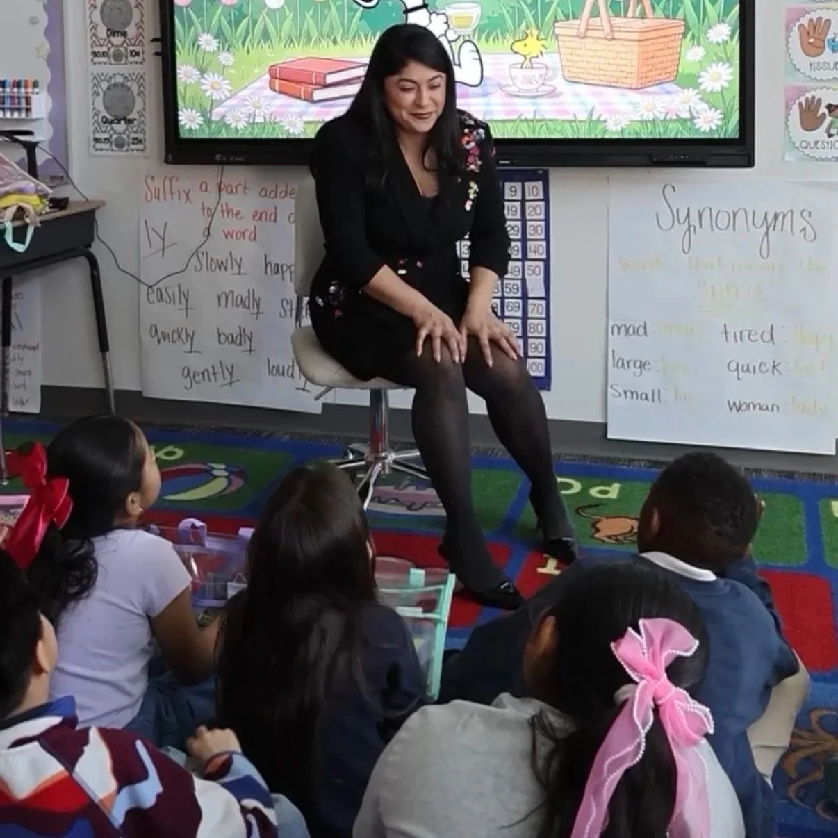 Daniela Madrid Hadges, from House of Law,reading to elementary school students in Las Vegas