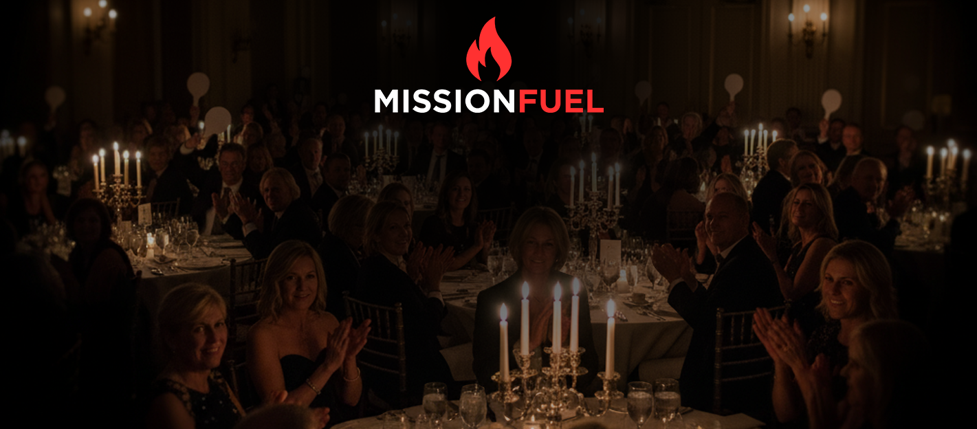 A group of young people dancing and celebrating at a party with blue and purple lighting, some with raised hands, while a person in black and green clothes is being lifted or thrown into the air.