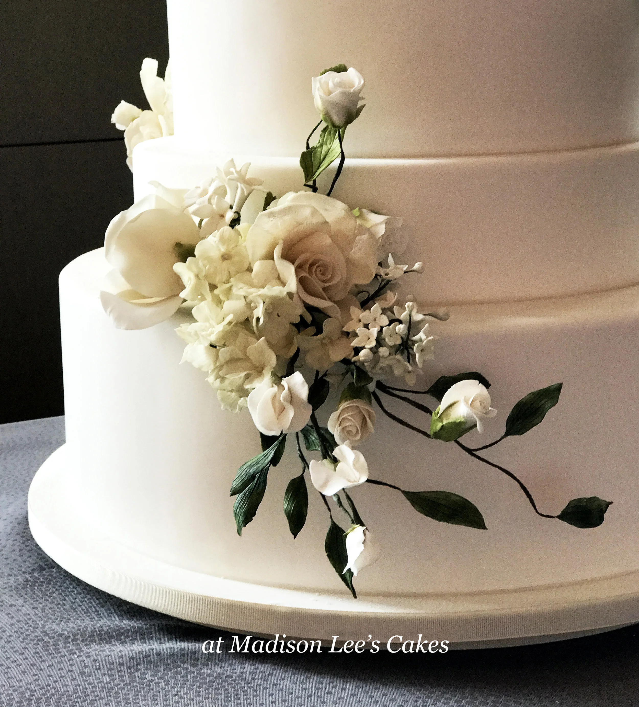 white cake with white text.jpg