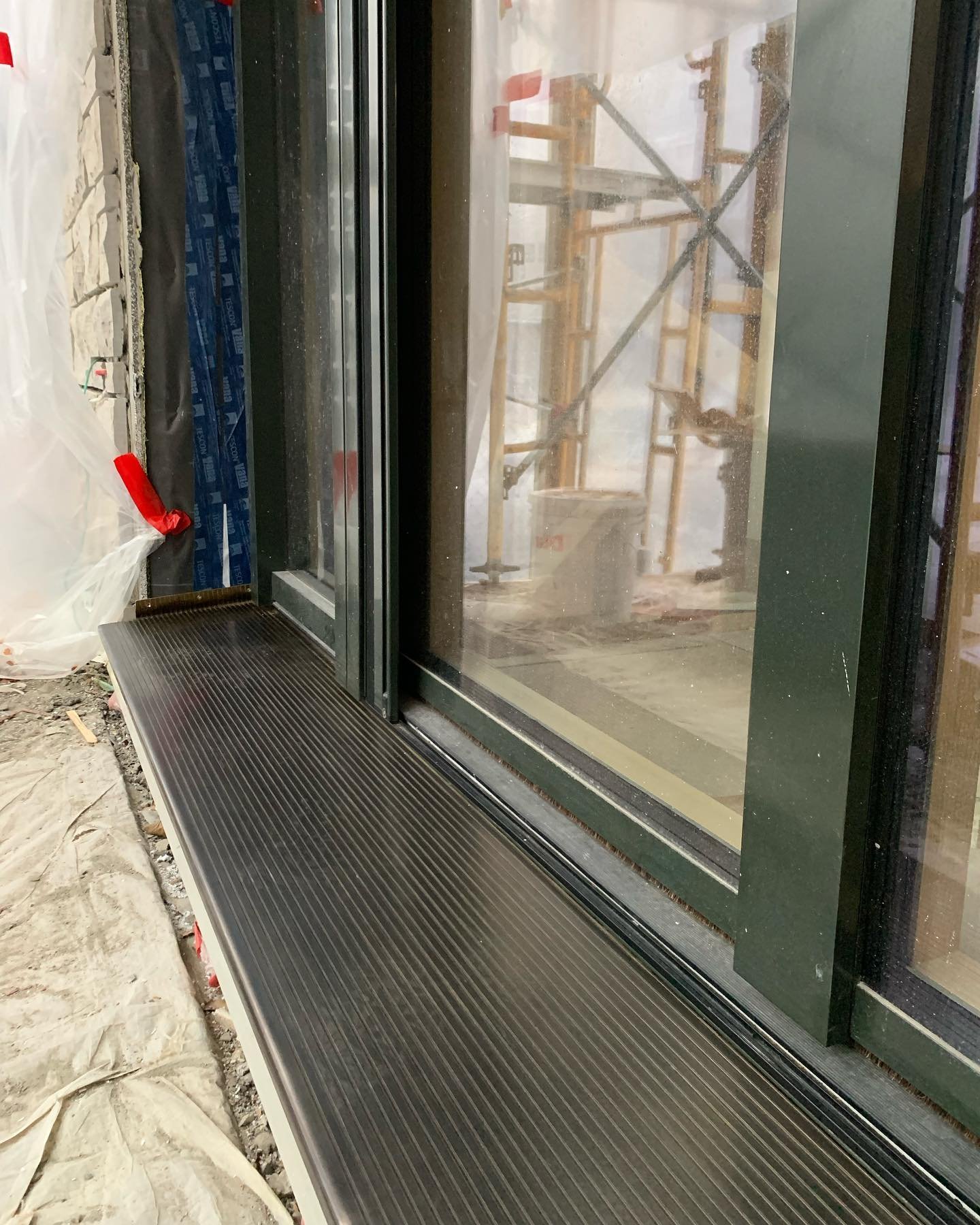 Custom bronze @realeborn door sills installed over PHPP insulation with @enersigngmbh triple glazed windows. 

#passivehouse #custombuild #airtightness