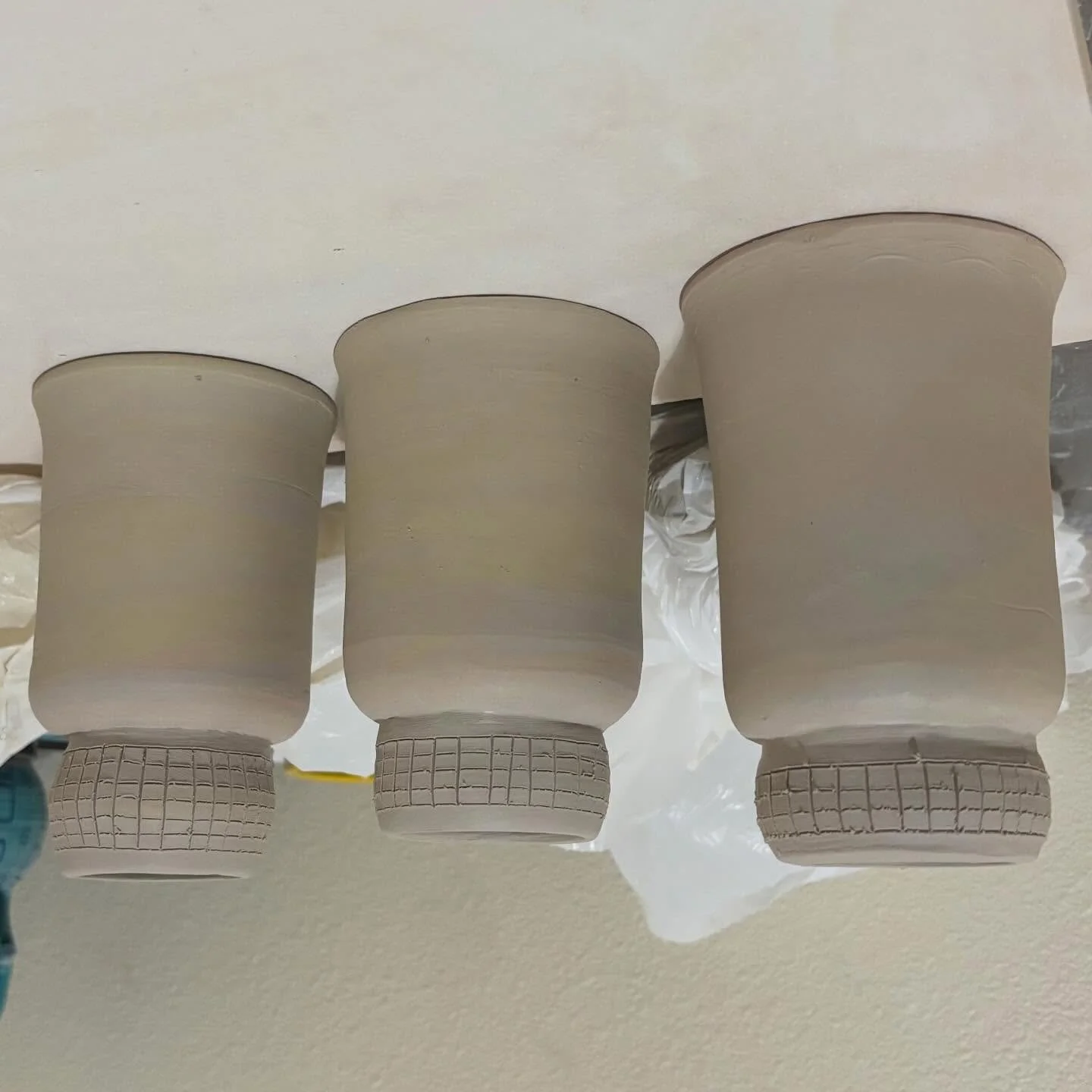 Can you see the vision? These cups are drying upside down right now, but I&rsquo;m really excited with how they&rsquo;re coming along. I can just barely see the mason stains peeking through the wet clay. Can&rsquo;t wait to bisque fire them next week