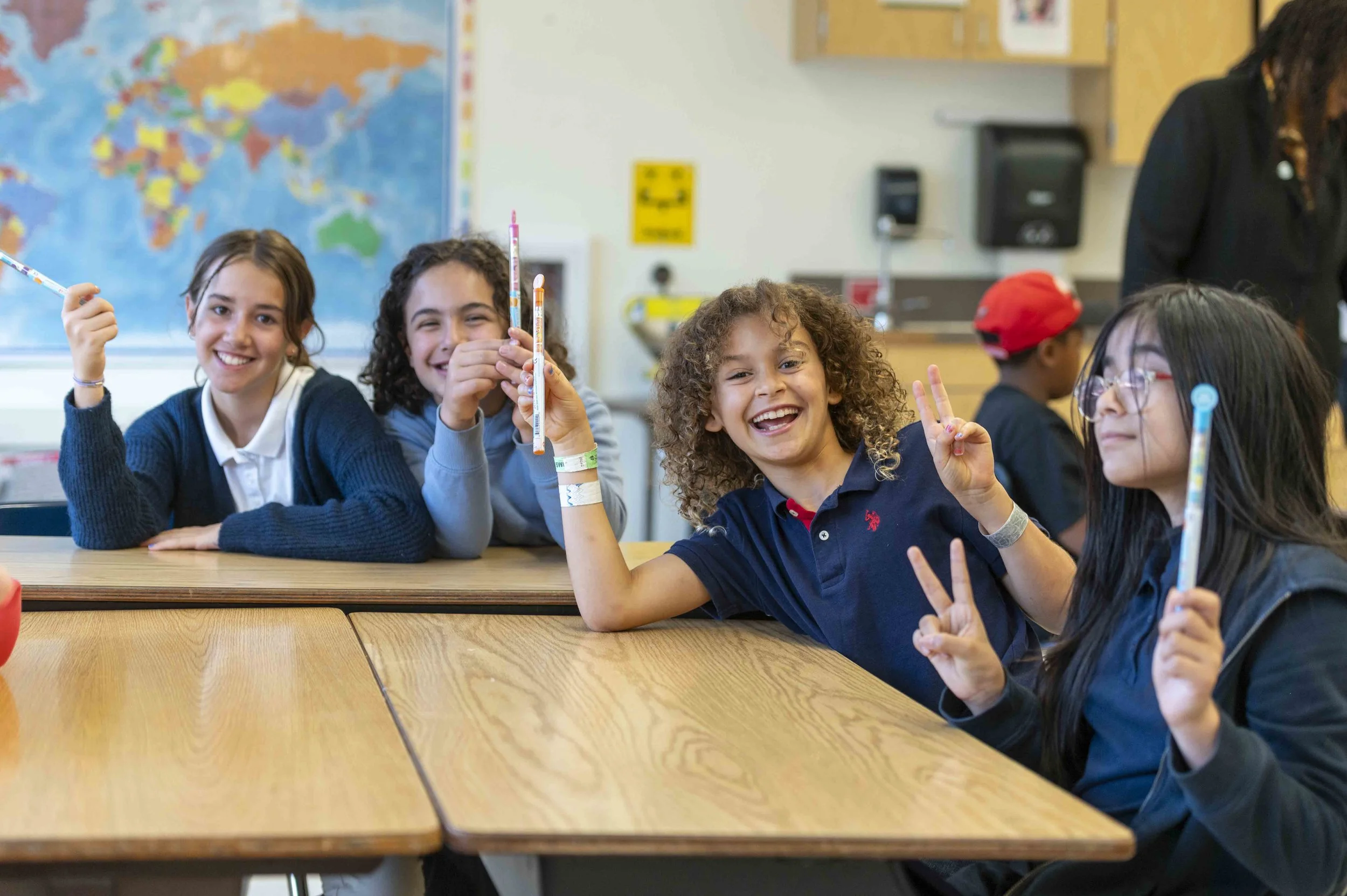 Students Smiling Peace Sign.jpg