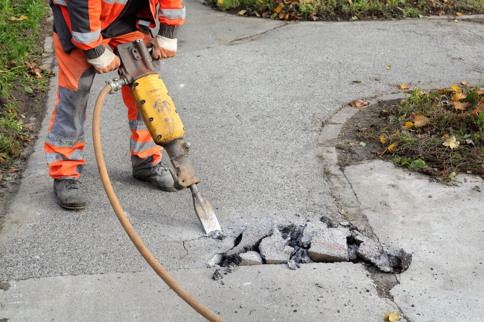 Air Hammer Breaking Sidewalk.