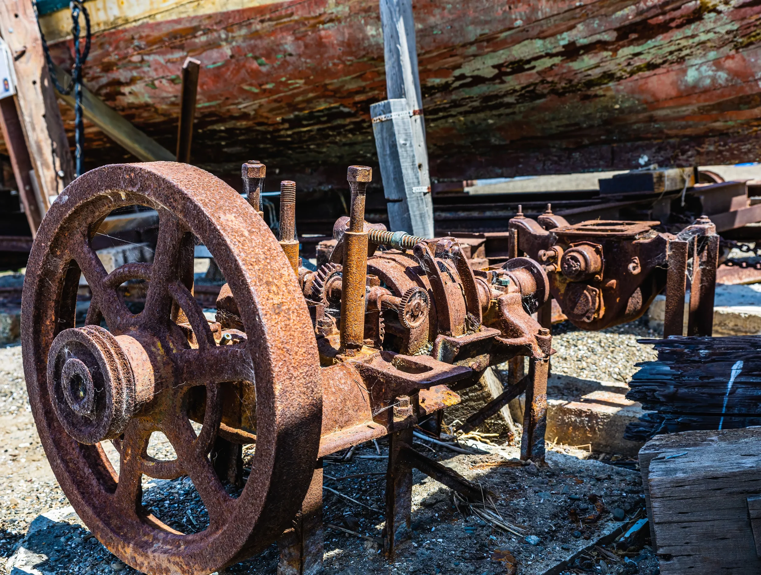 A Rusted, Vintage Industrial Machine in a Boat Yard Representing Something with Bearings That Grease Cannot Fix.