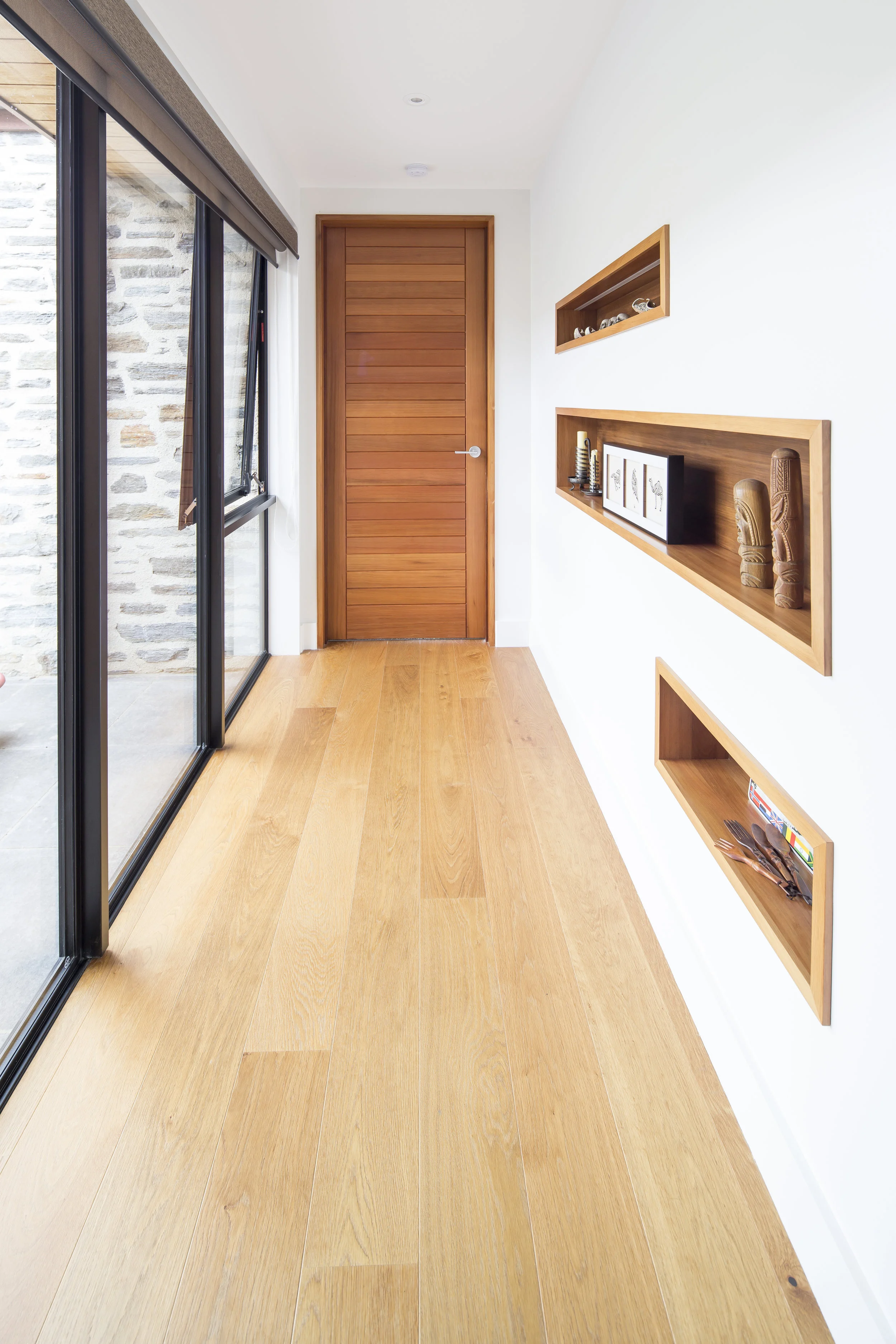 Gorgeous timber recesses feature family treasures