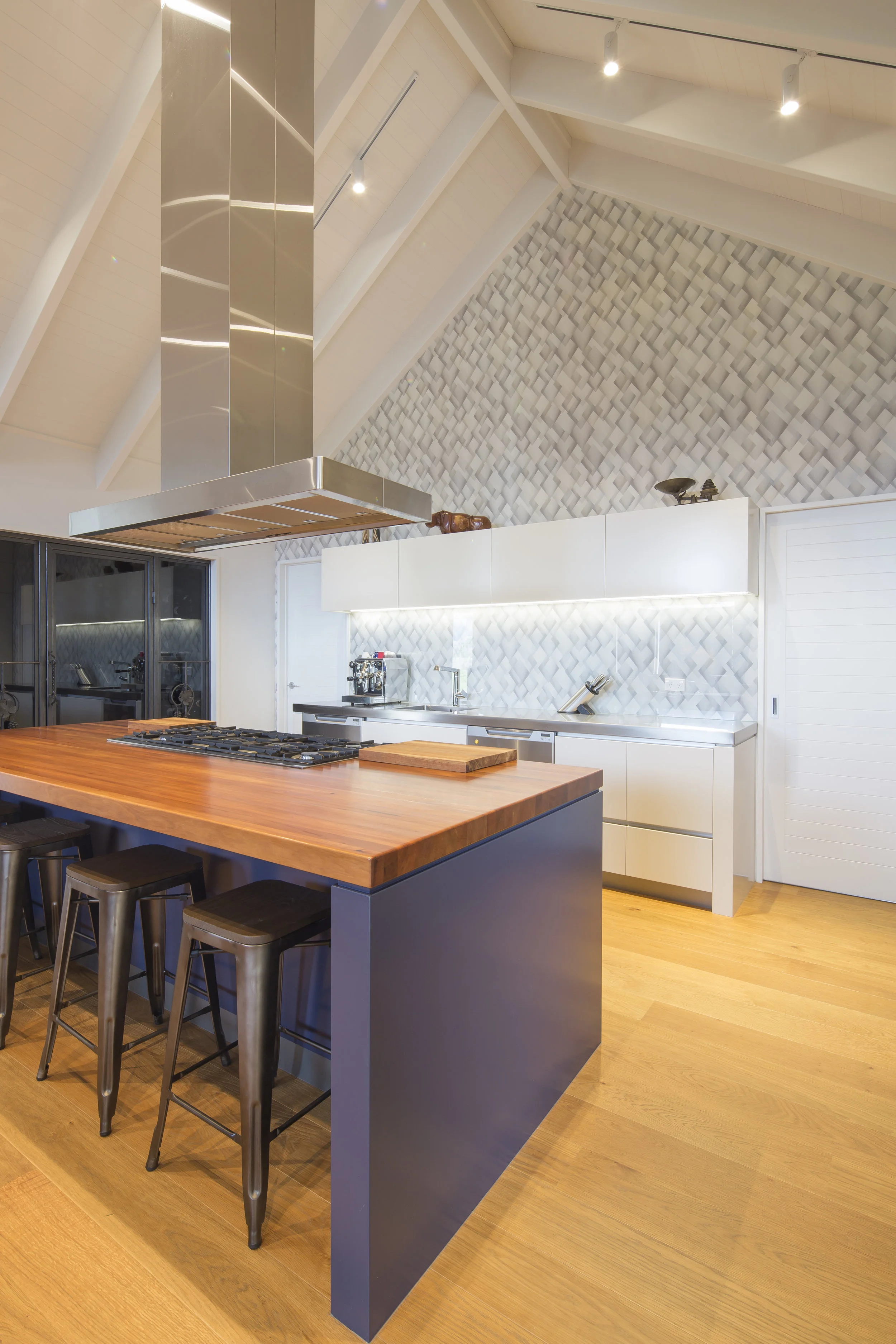The kitchen’s wallpaper complements the views out of the windows